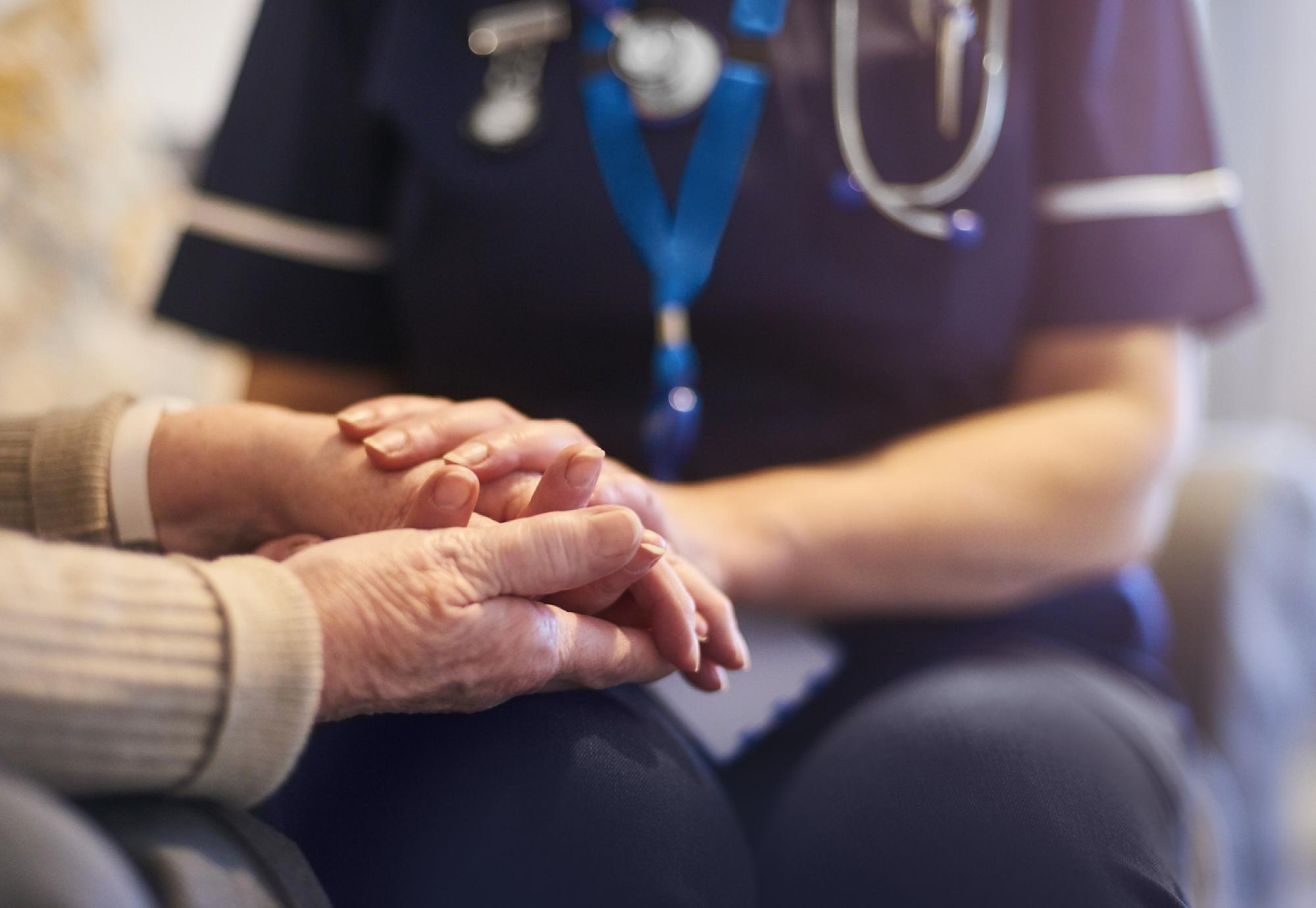 Nurse comforting patient