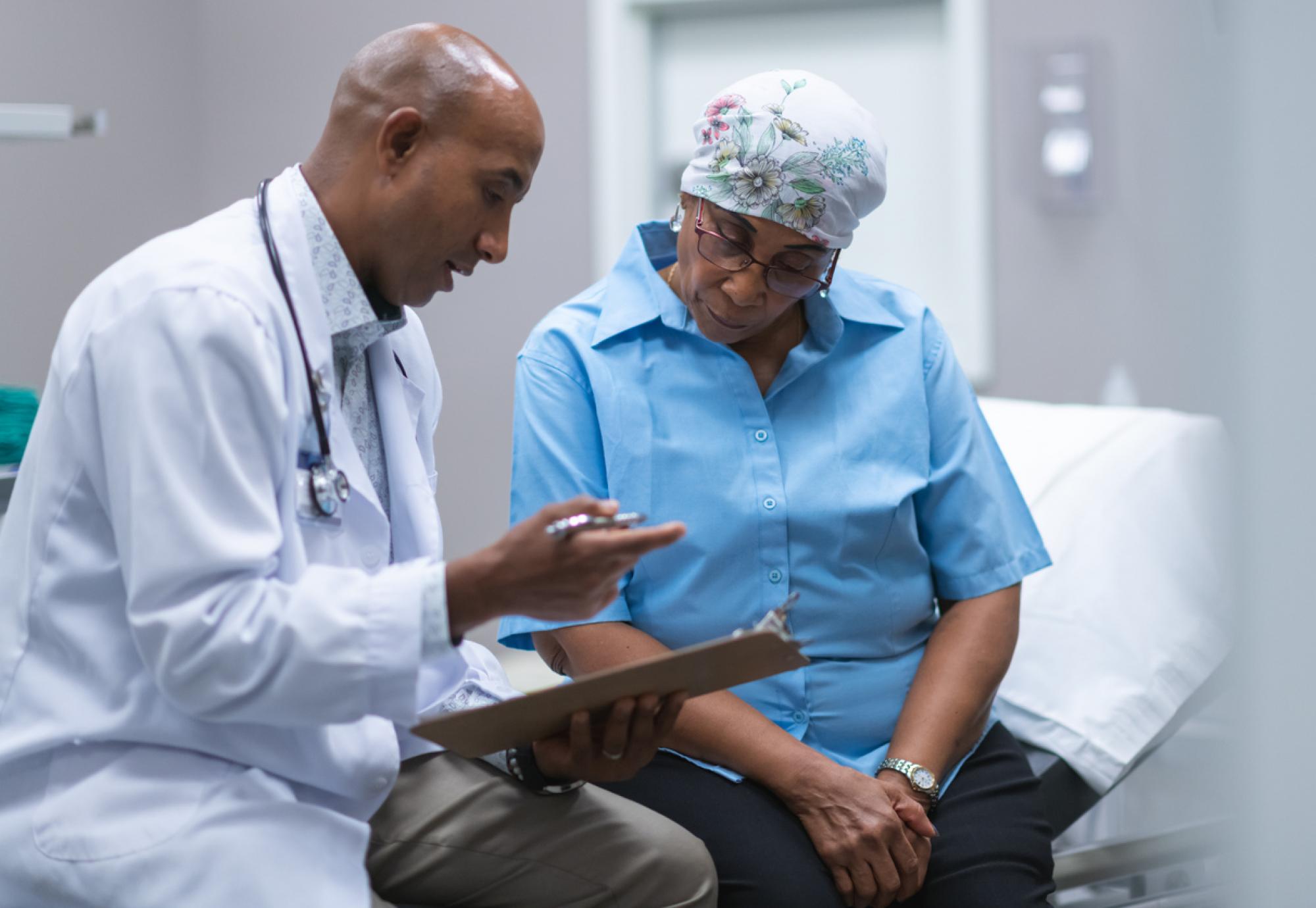 Black woman with cancer having medical consultation