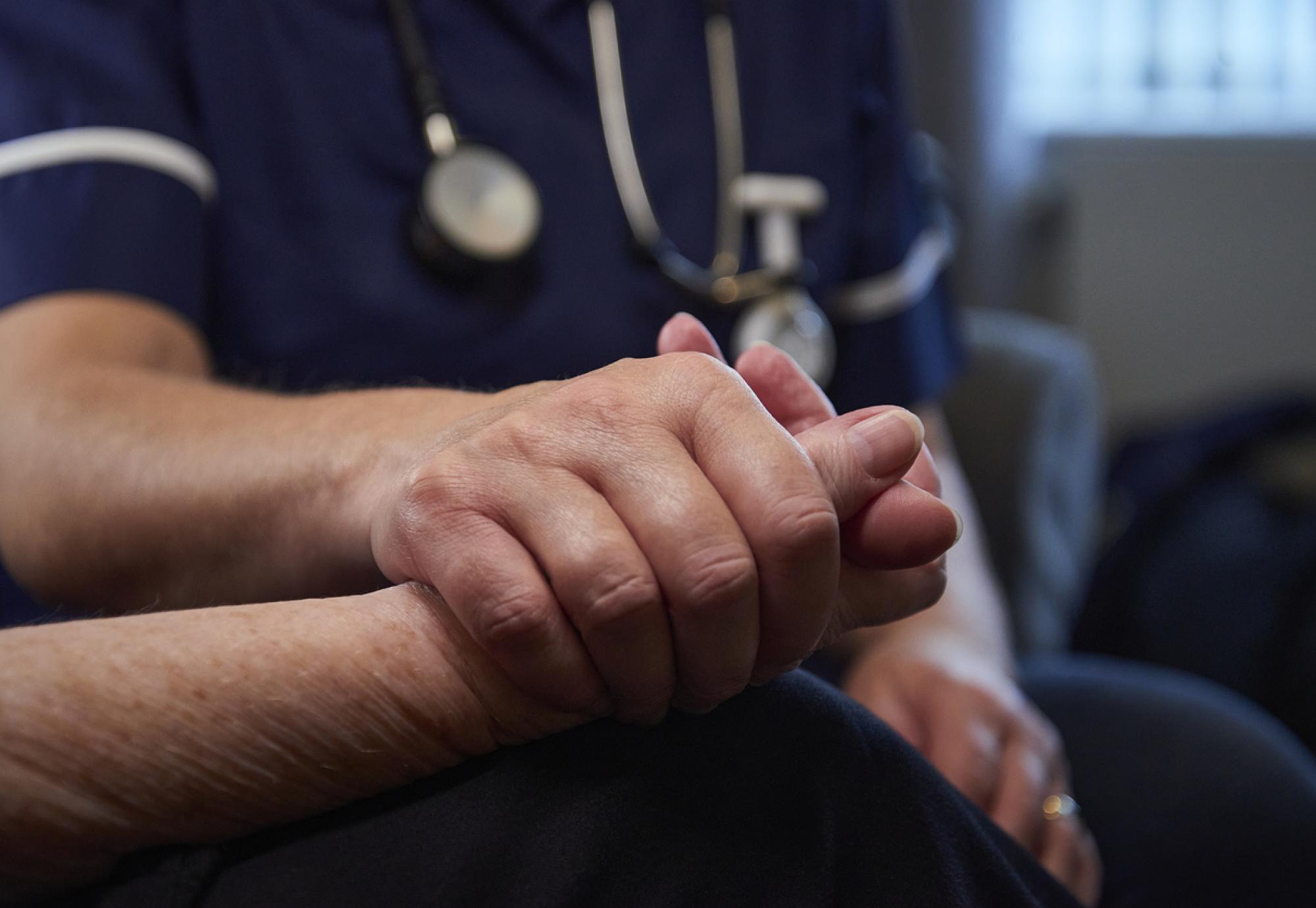 Nurse comforting patient