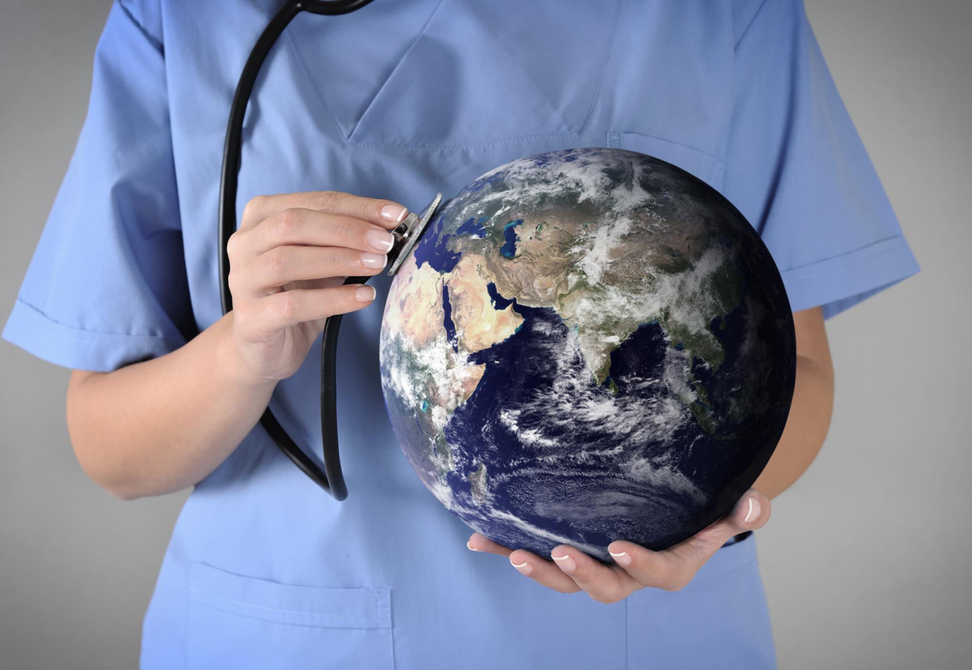 Clinician holding a globe