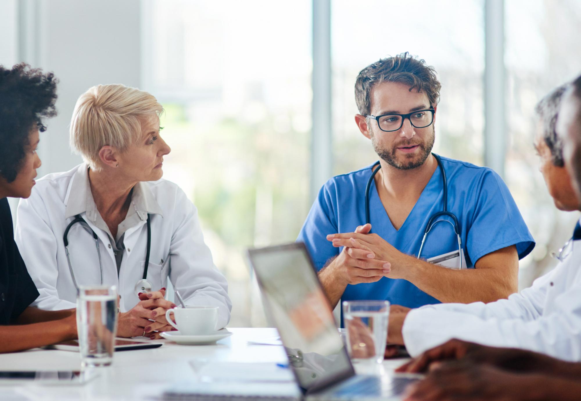 Healthcare workers talking in a meeting