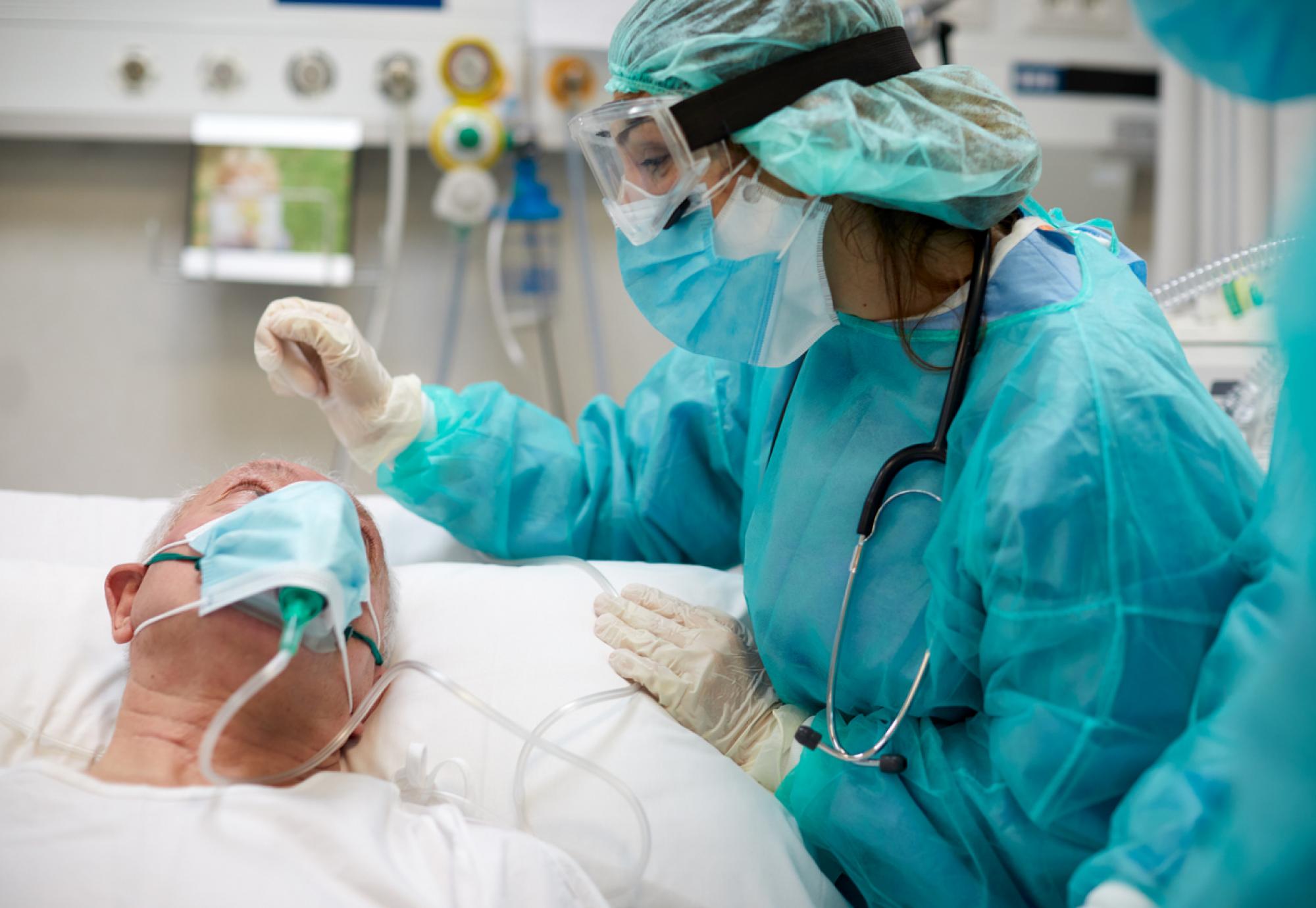 Nurse comforts Intensive Care Unit patient