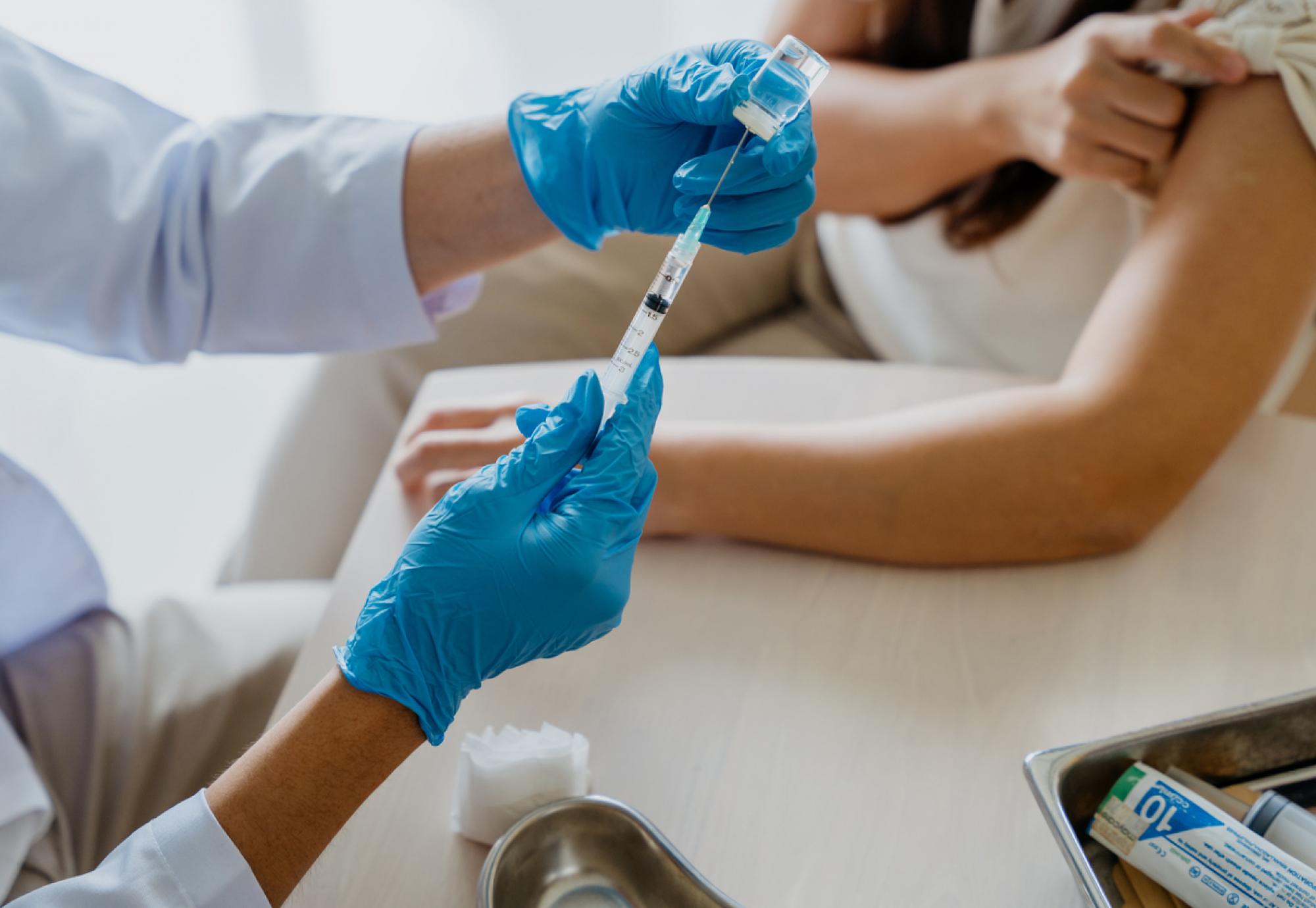 Female patient getting vaccination