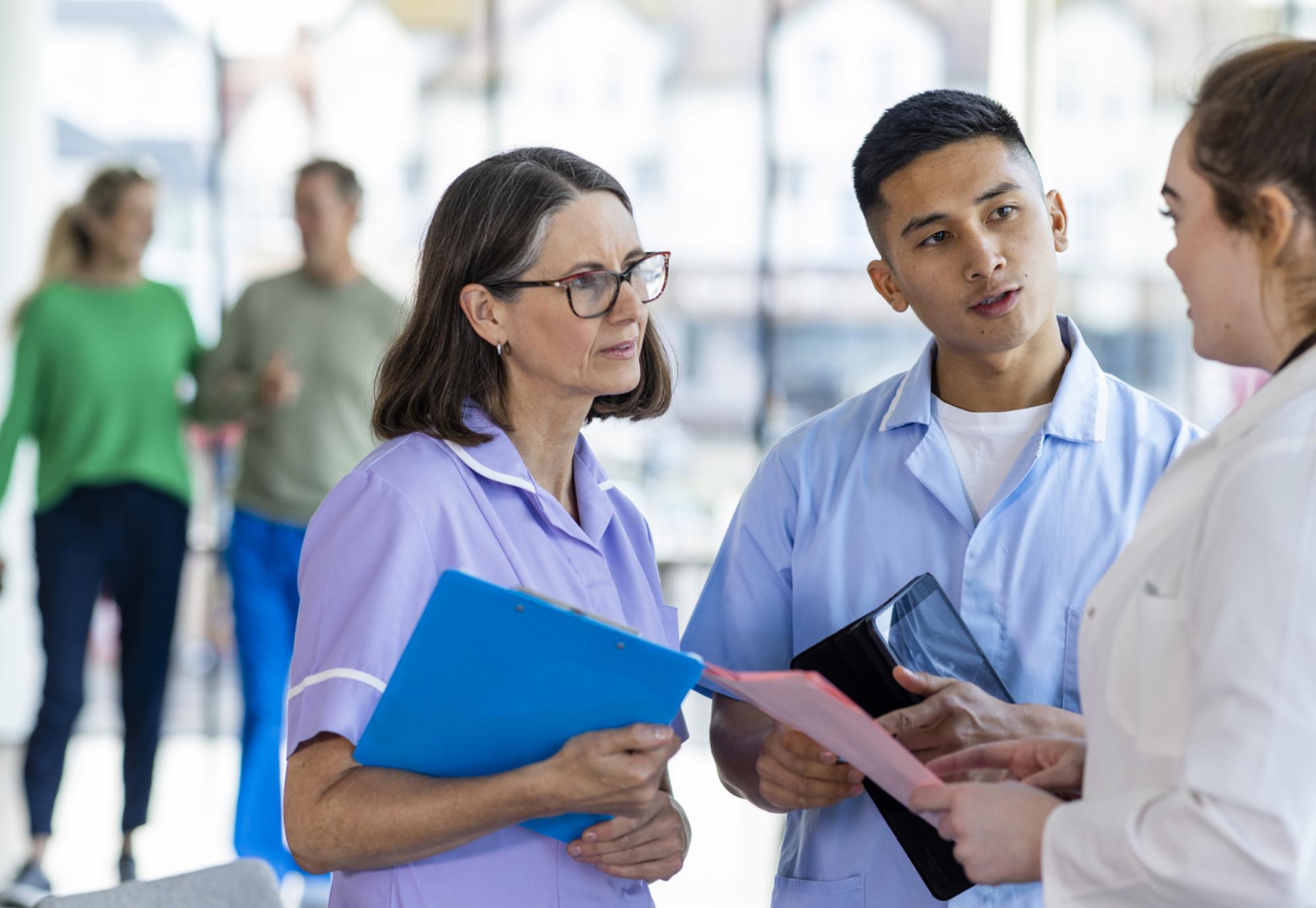 Nurses and doctors discussing treatment plan