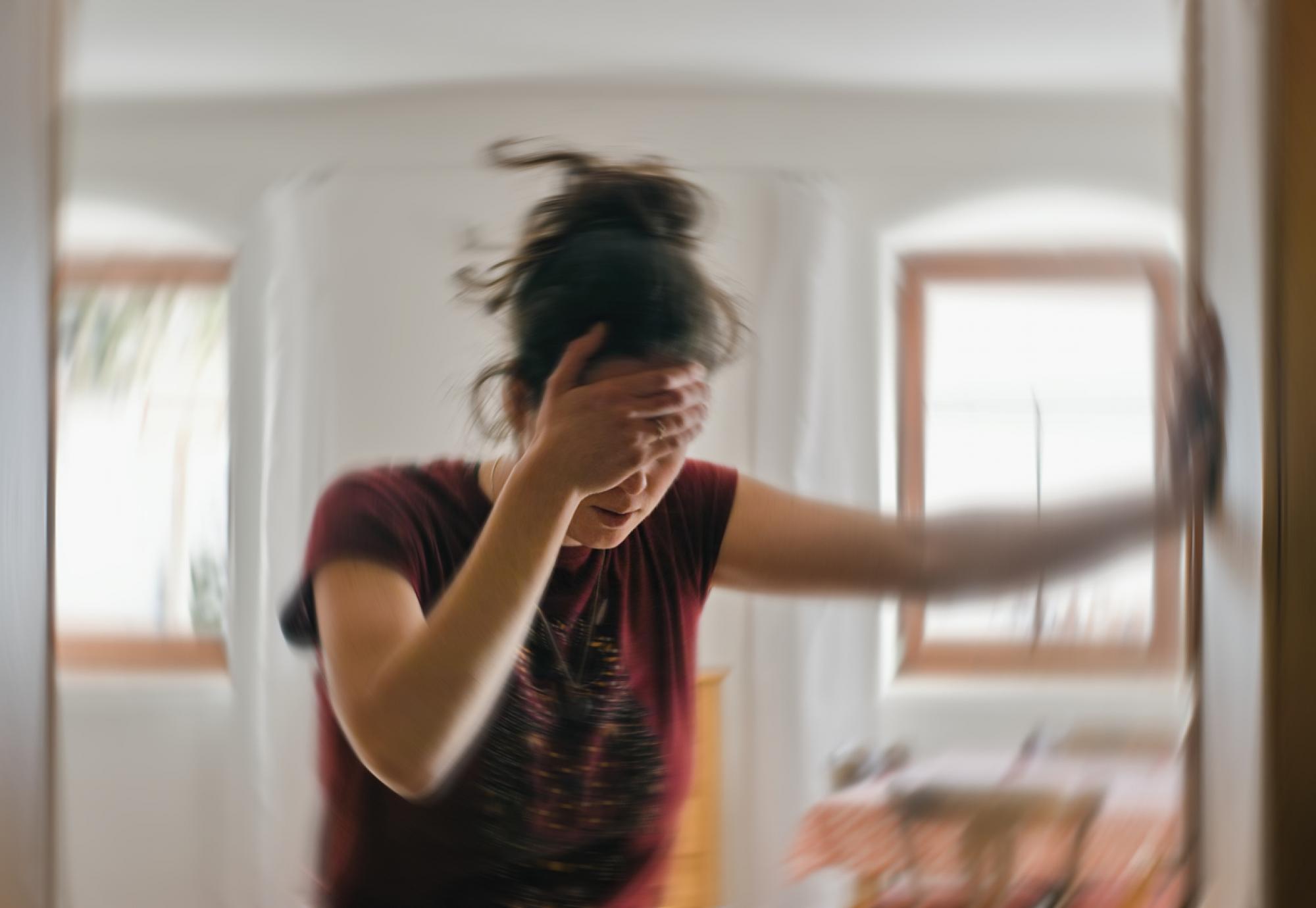 Woman holding head