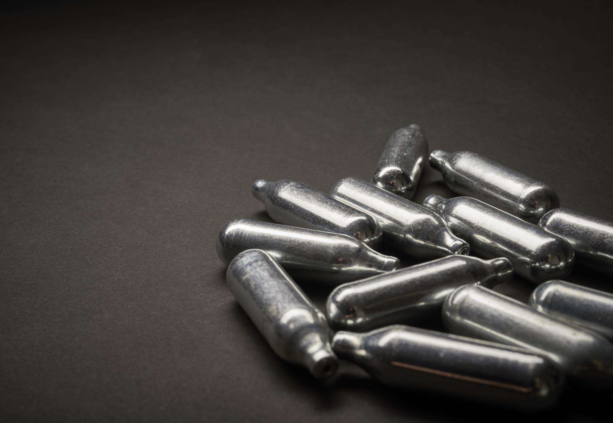 Nitrous oxide canisters on the ground