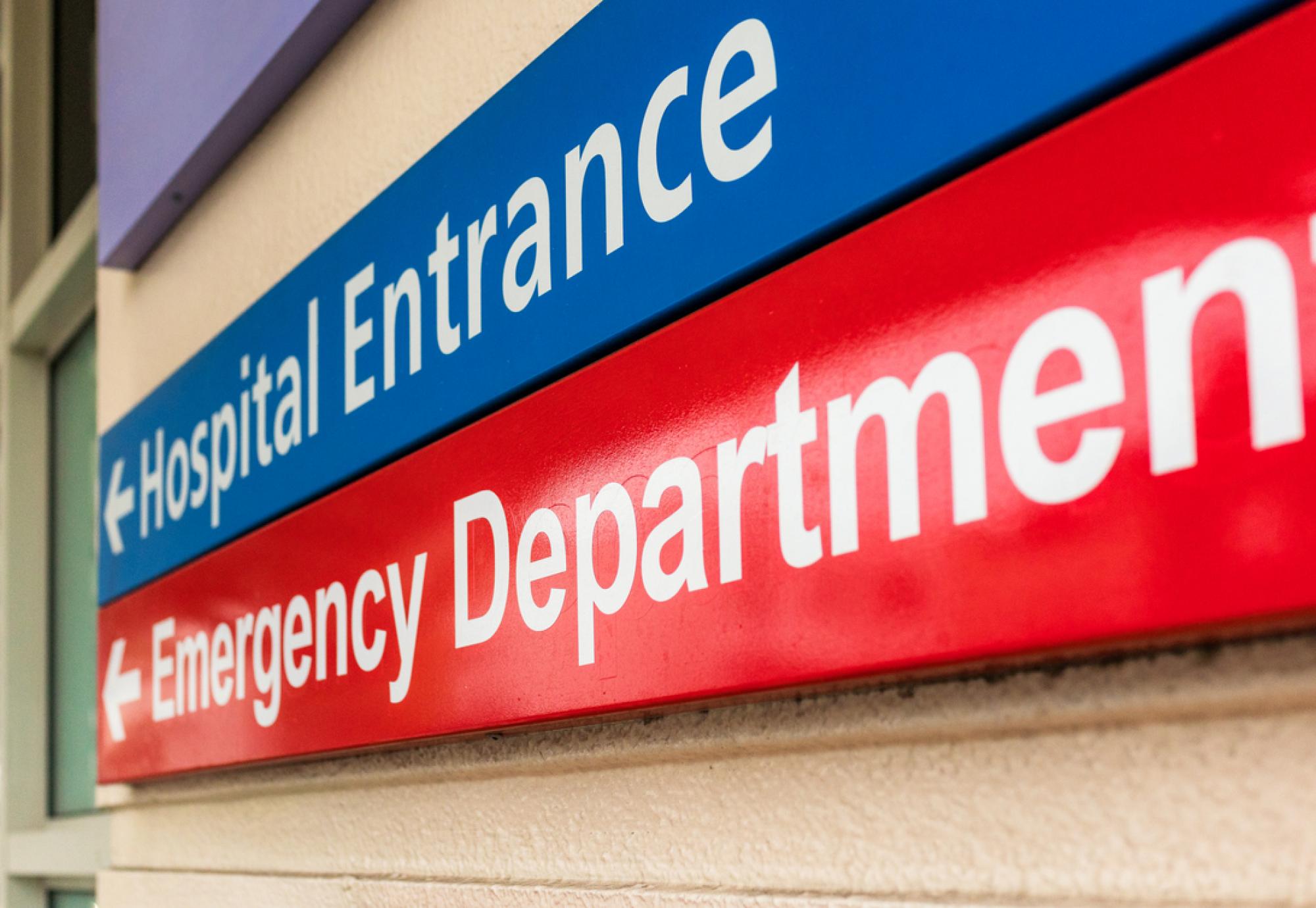 Hospital entrance and emergency department sign