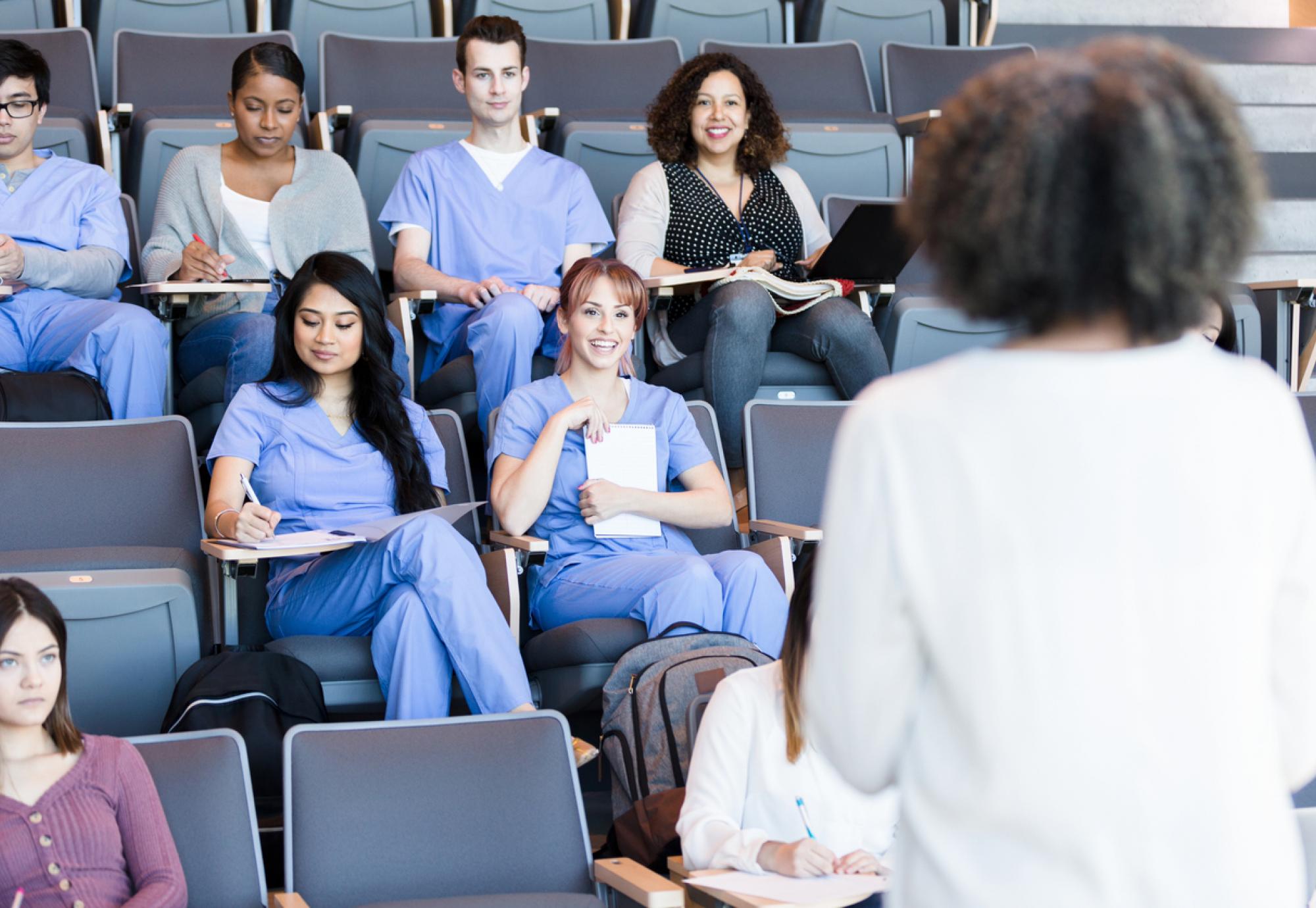 Healthcare educator teaches class of medical students