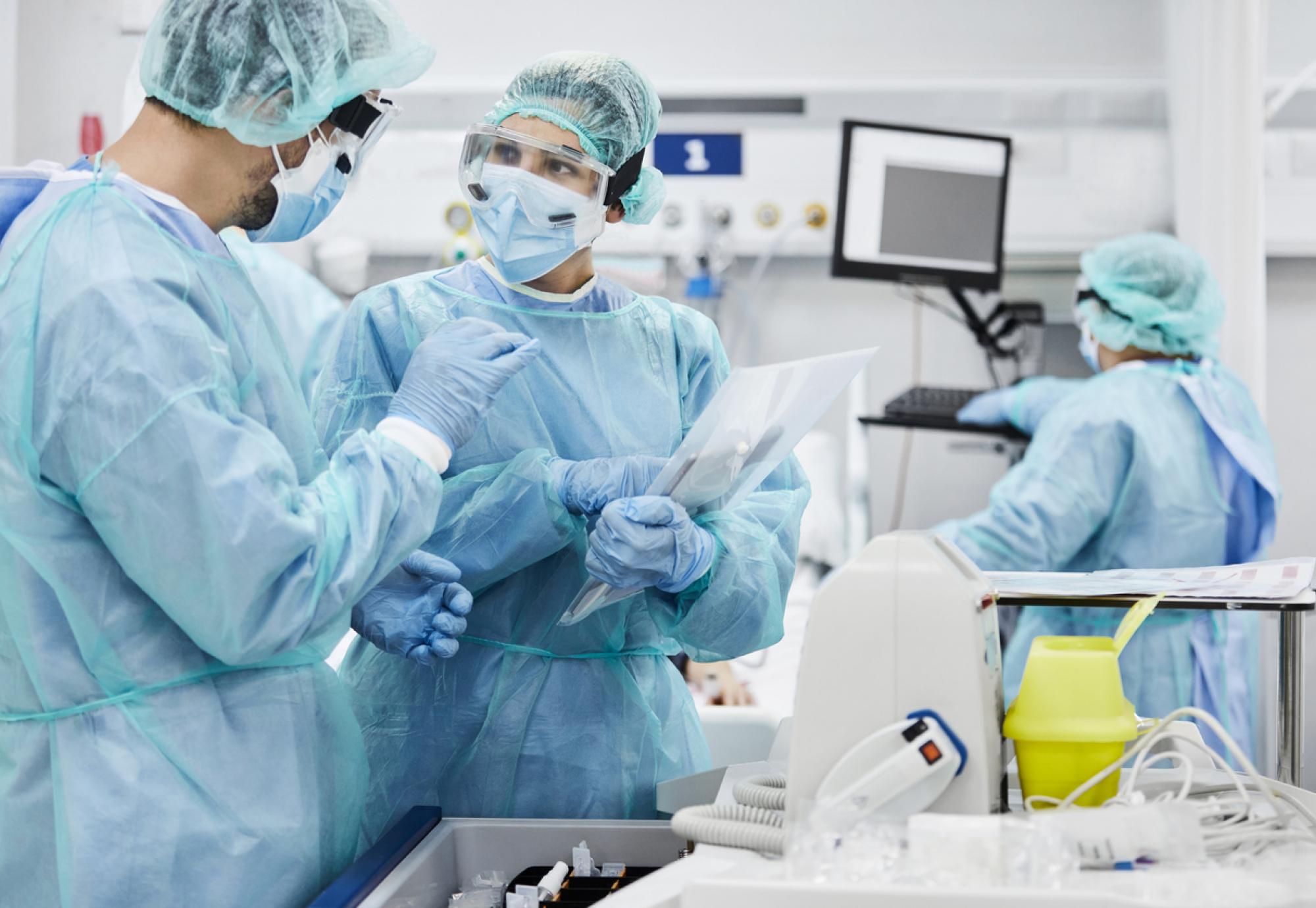 Health professionals working in an intensive care unit