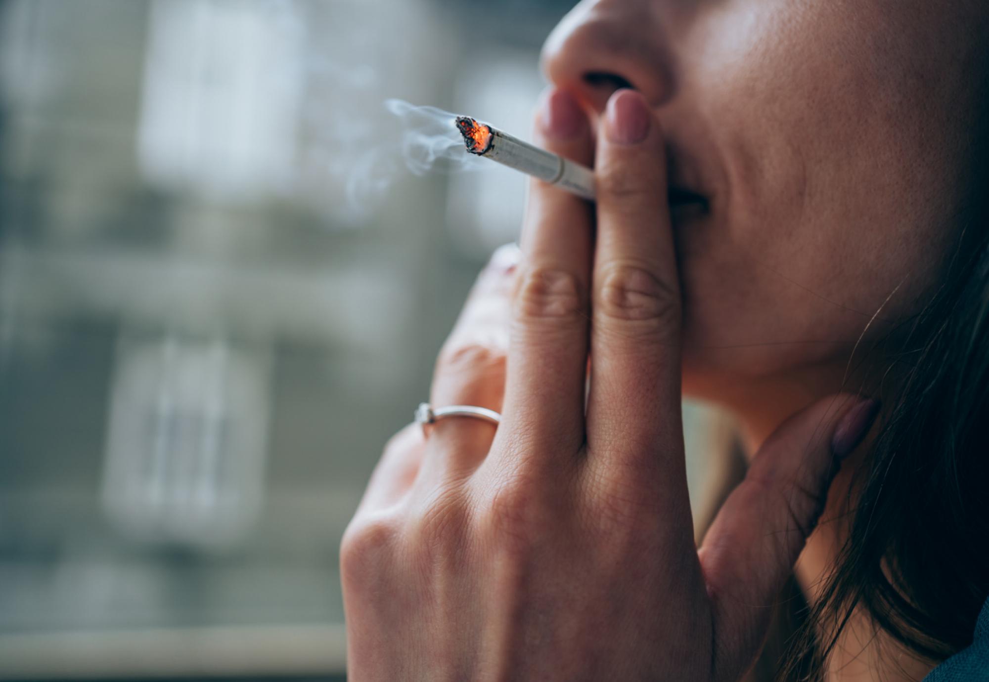 Young woman smoking a cigarette