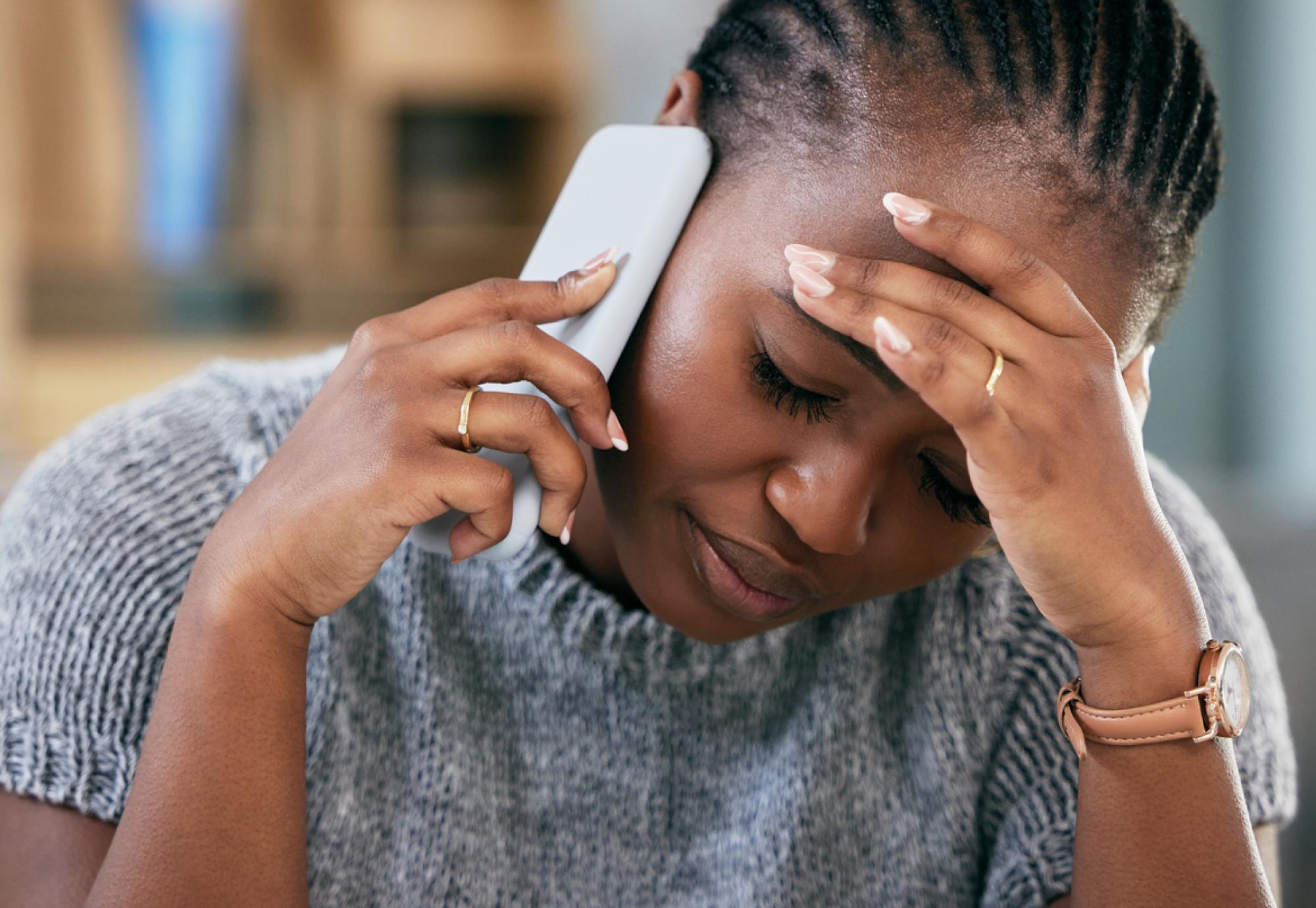Woman struggling with mental health on phone call