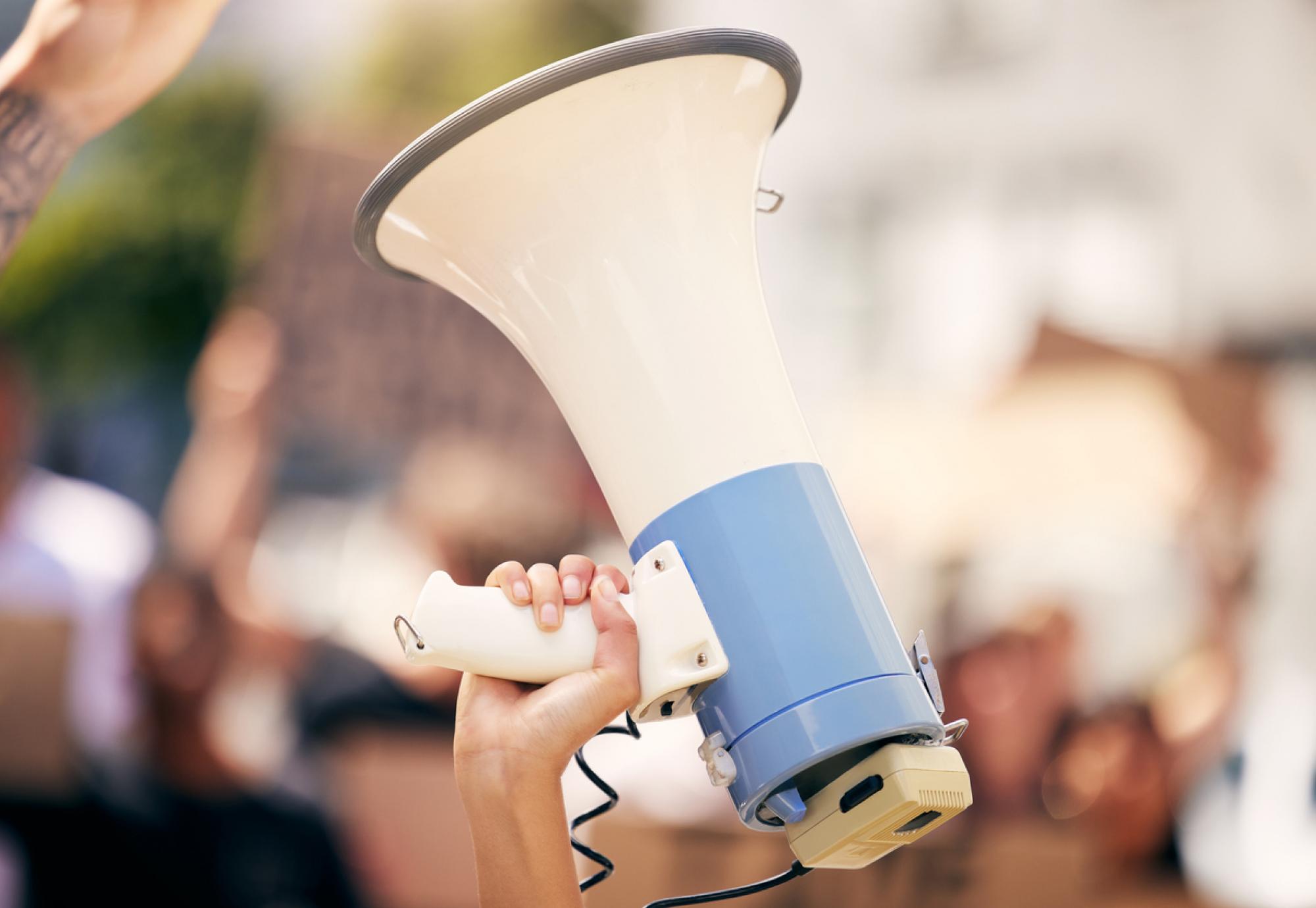 Protester holding a megaphone during a rally