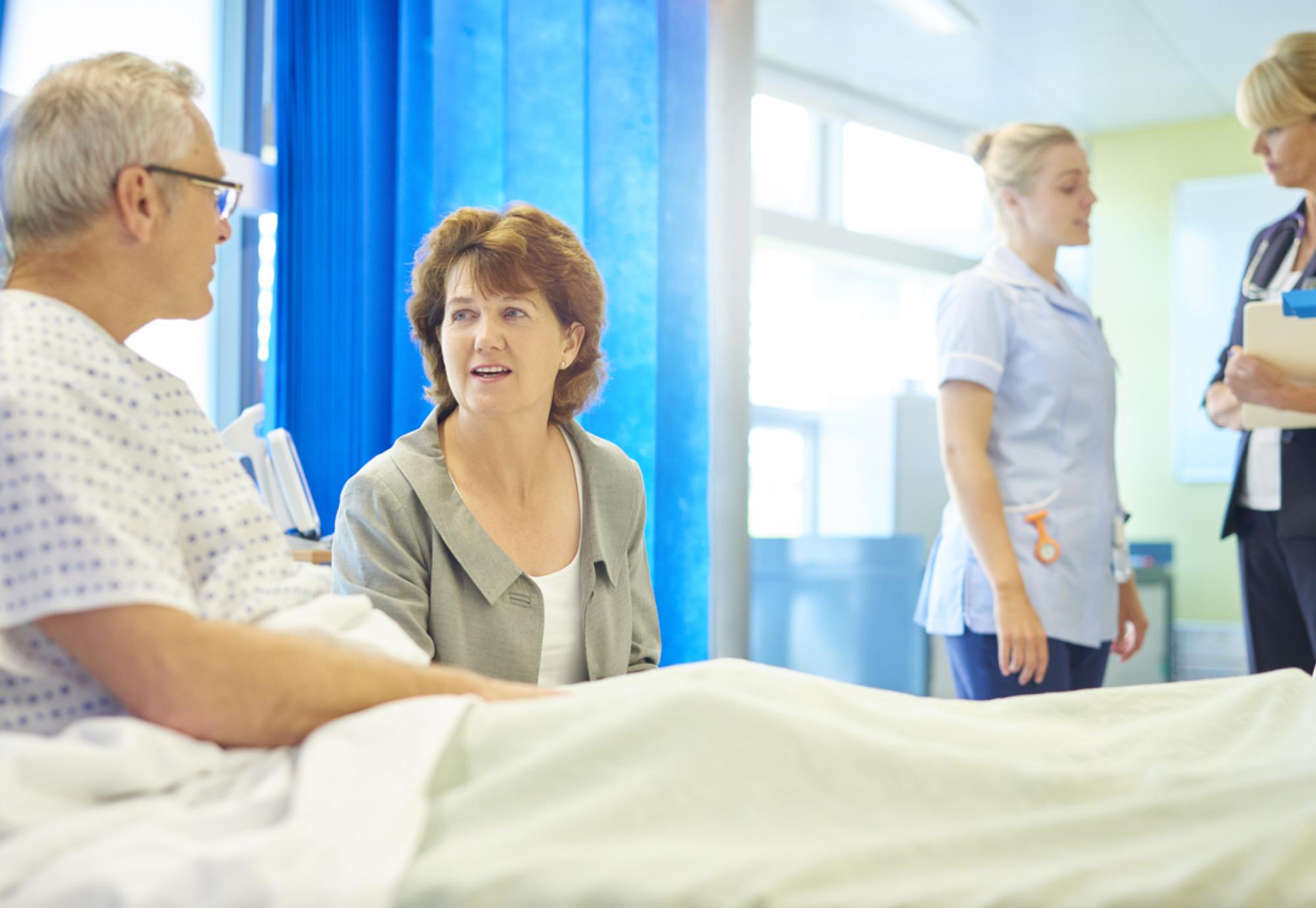 Elderly male patient in hospital bed