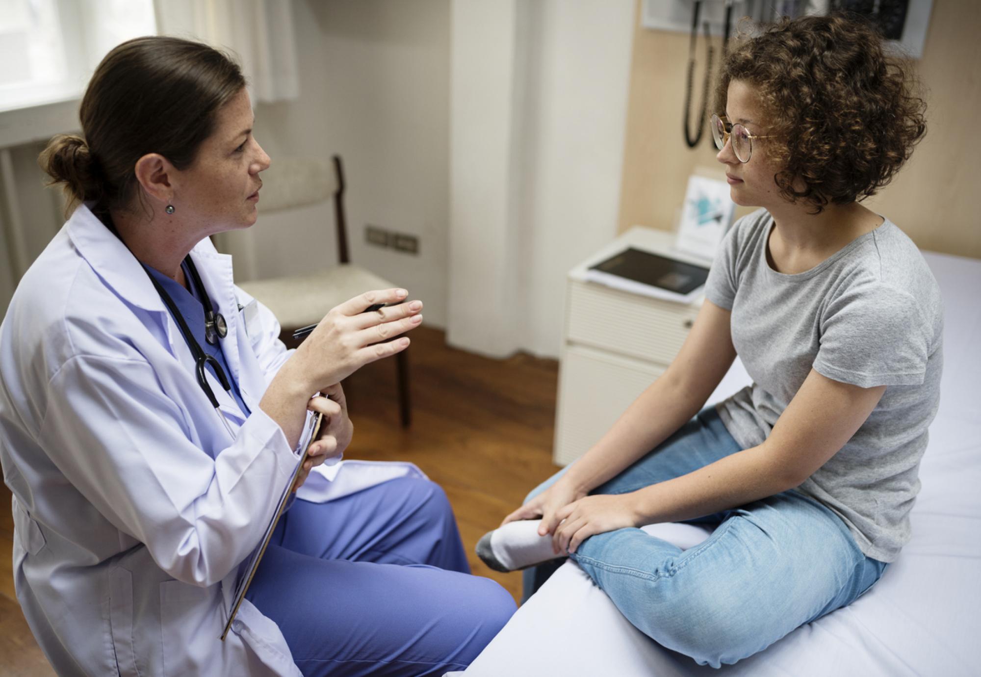 Clinician talking to female patient