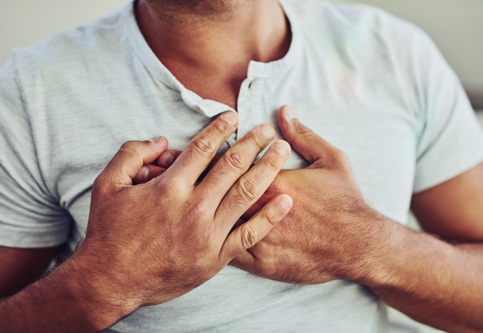 Man holding his chest