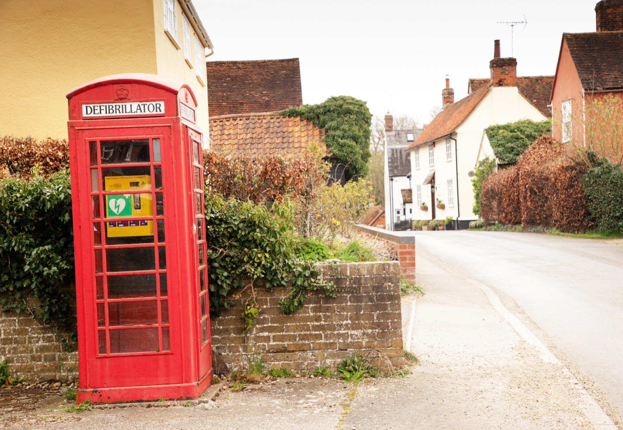 Defibrillator being used in an old phone box