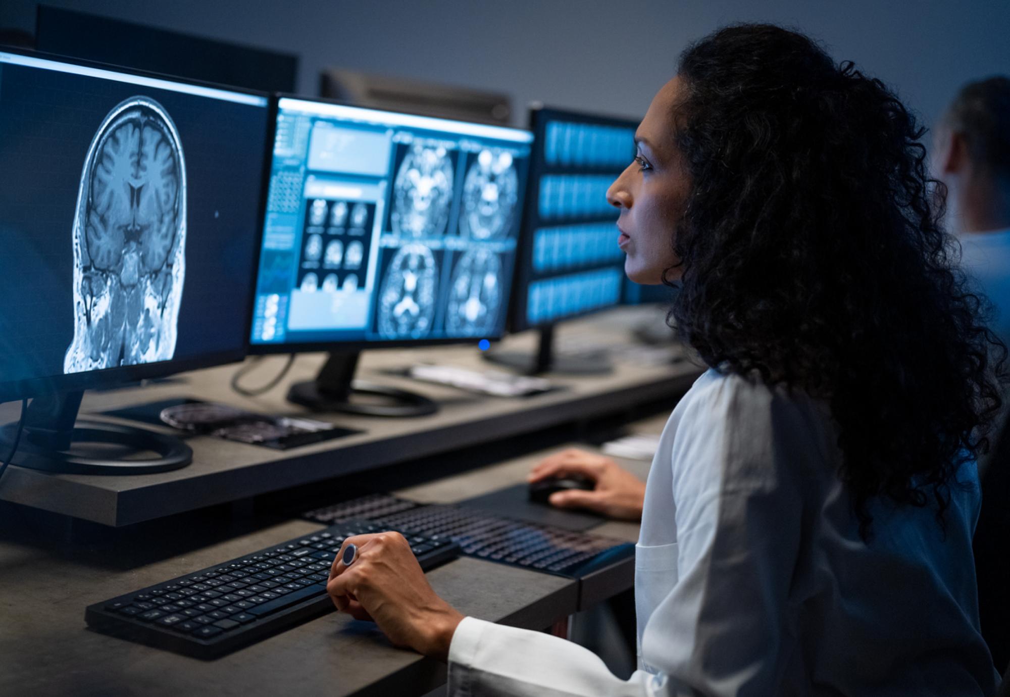 Female radiologist analysing the MRI image of the head