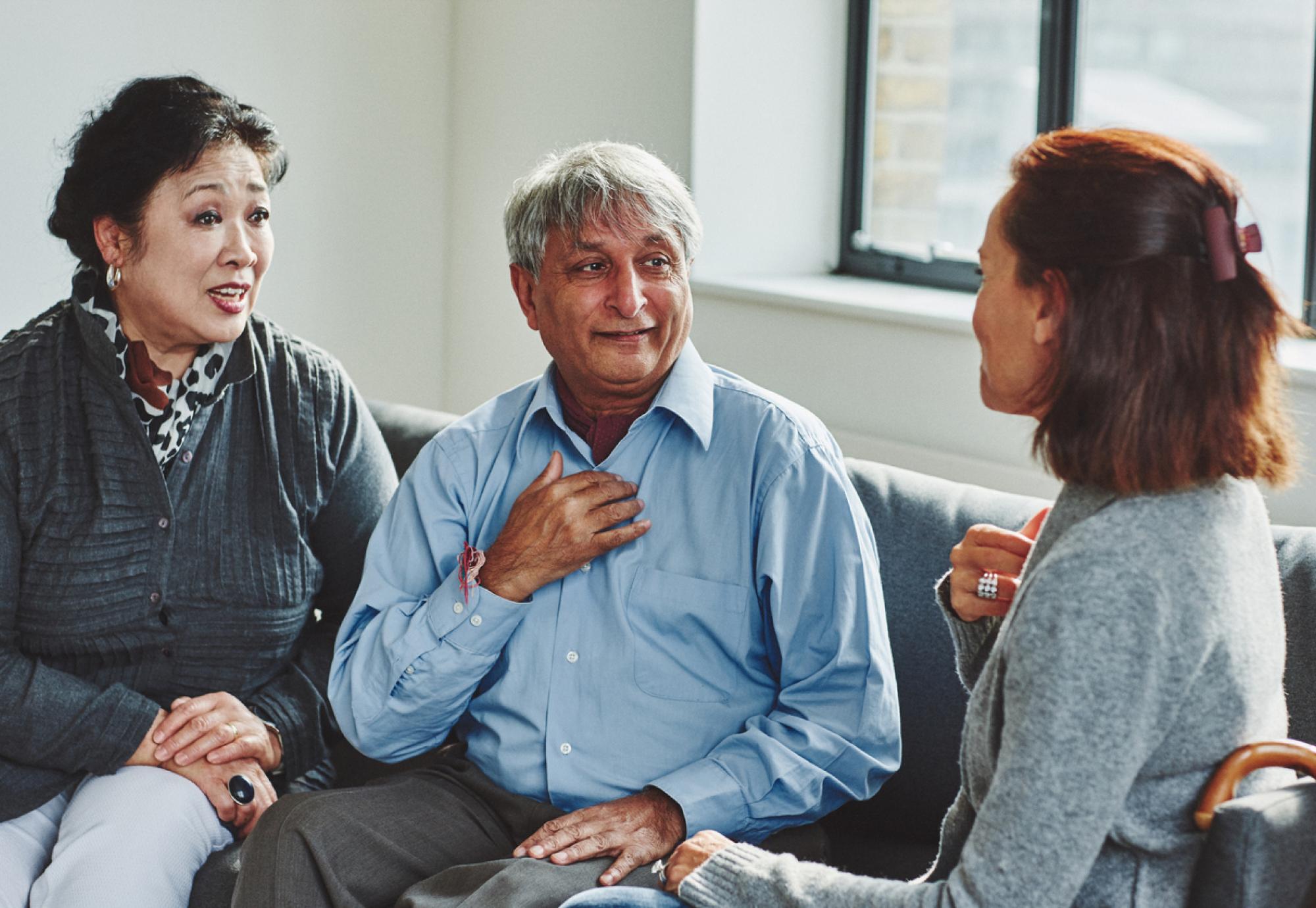 Female carer treating senior couple