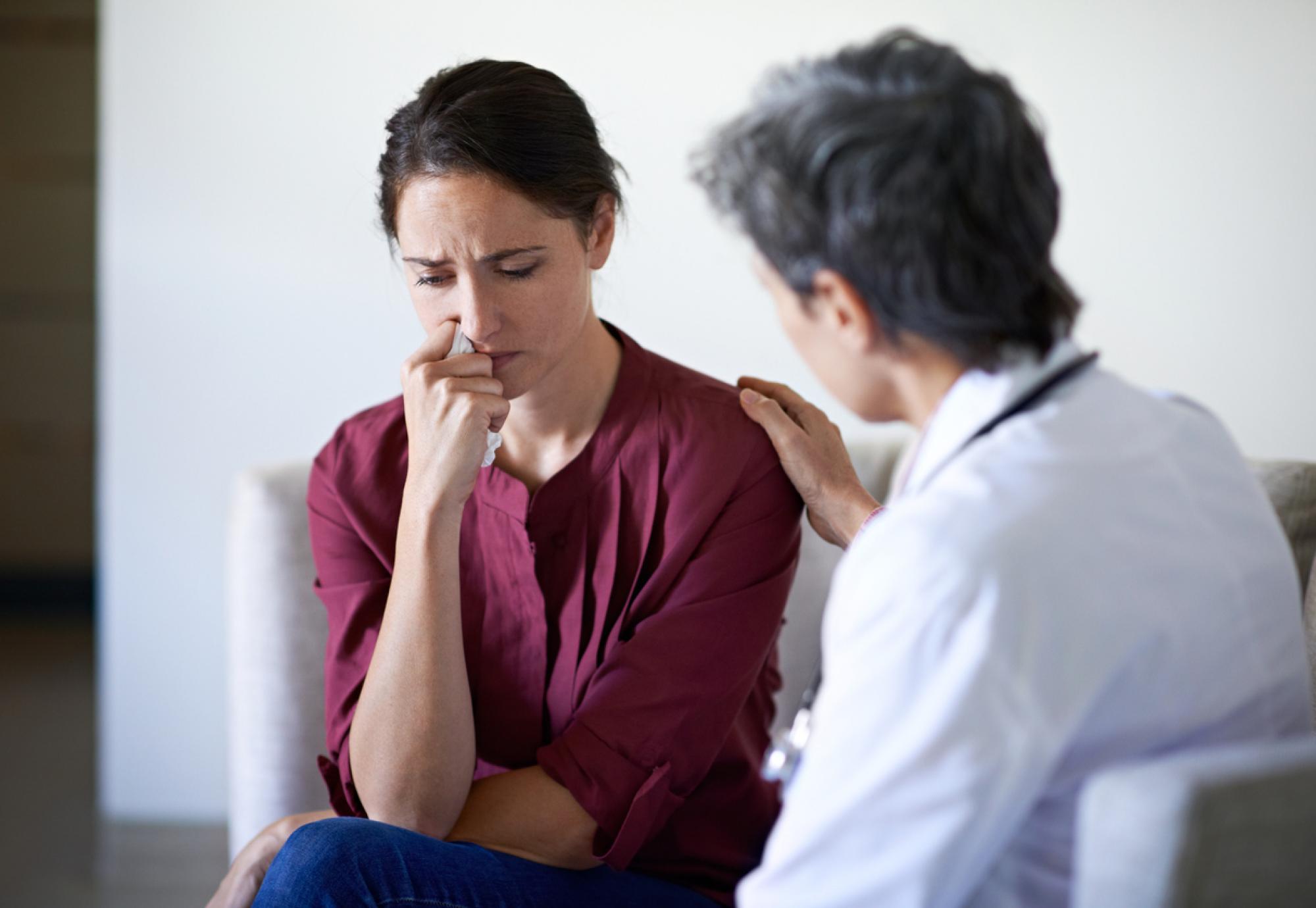 Health professionals with stressed patient