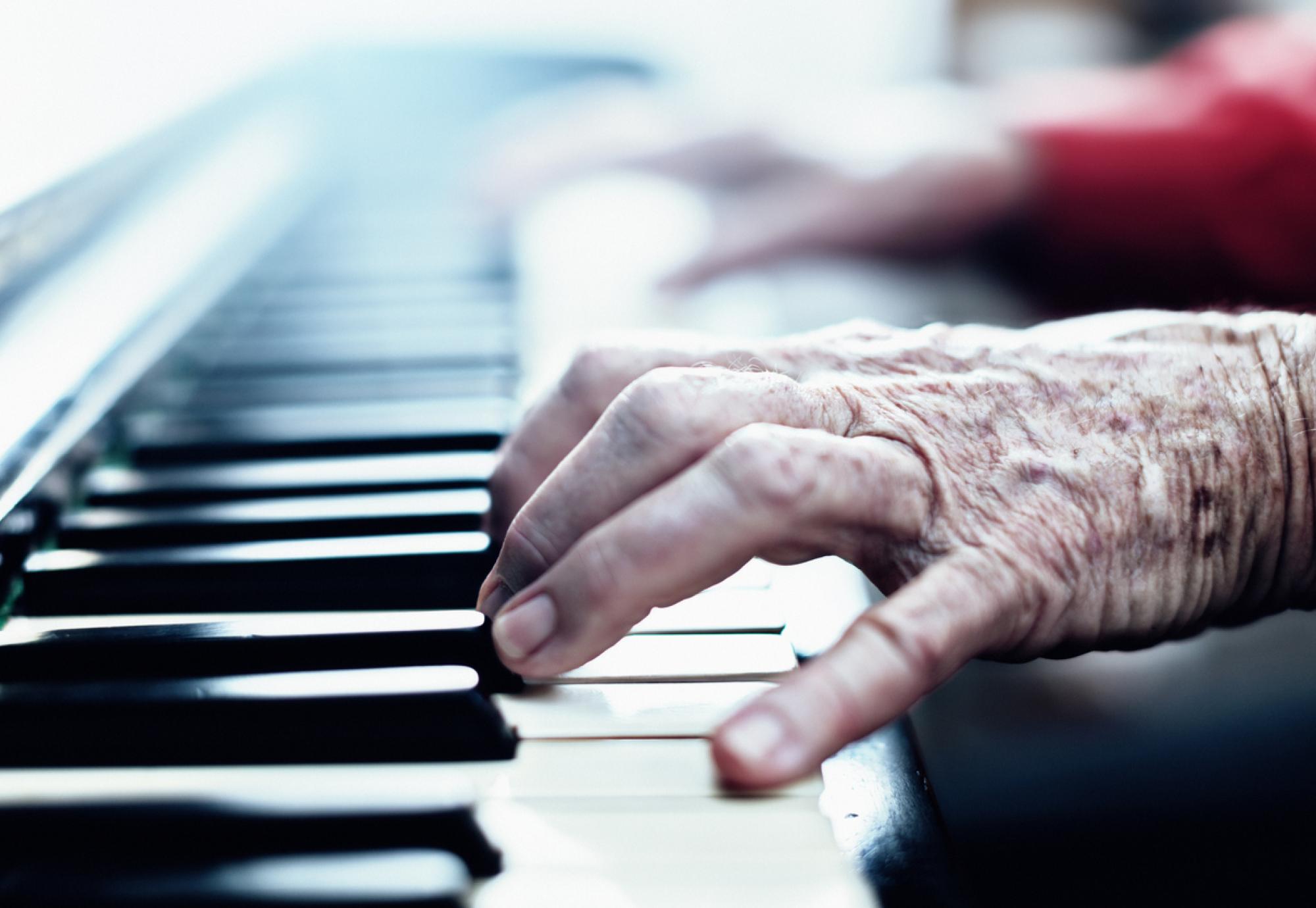 Senior woman playing the piano