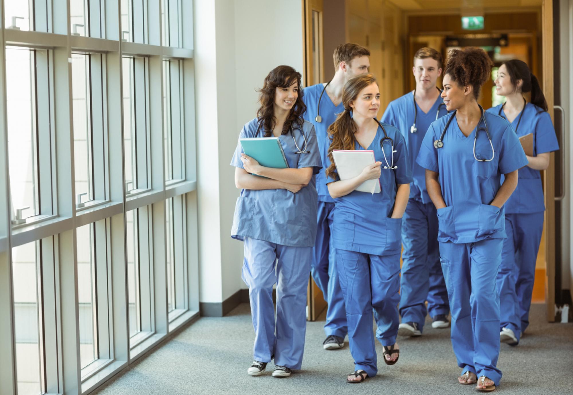 Medical students walking through a hospital