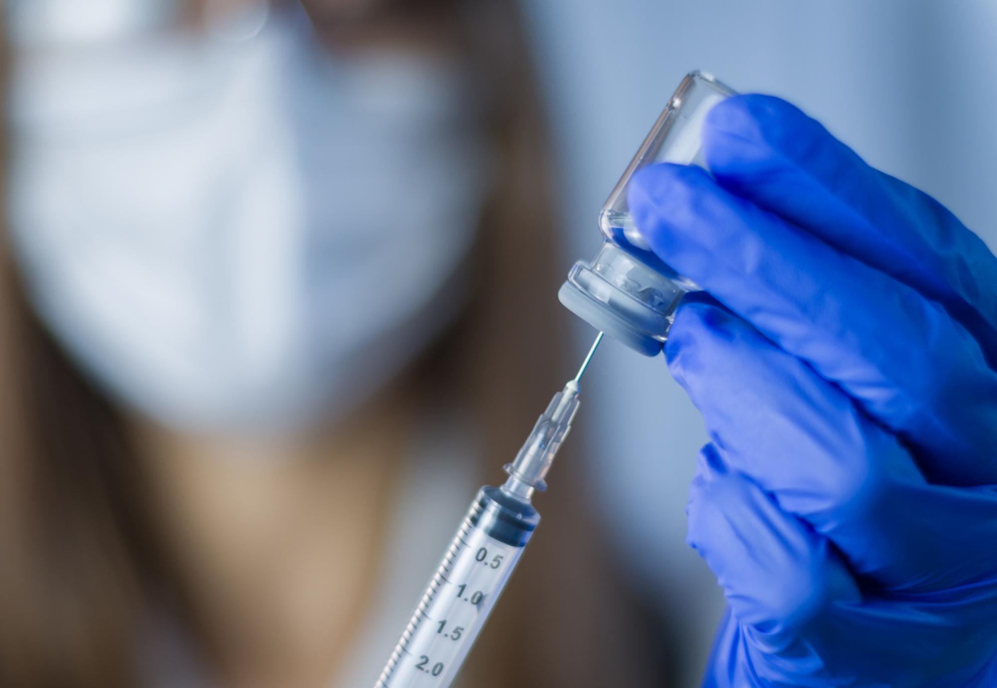 Researcher holding a vaccine