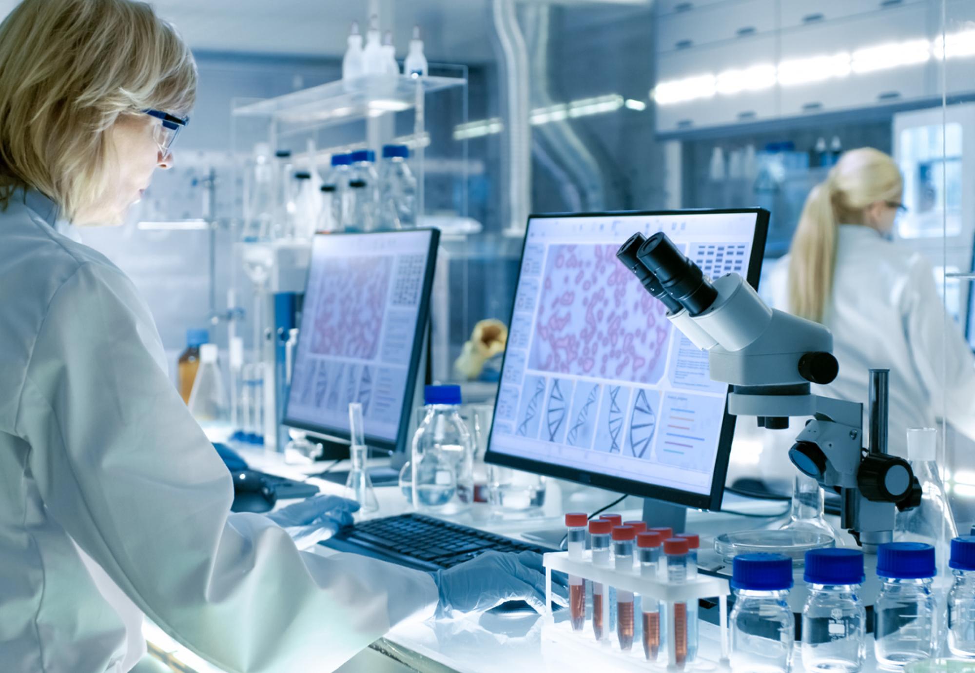 Woman in a laboratory depicting genomics research