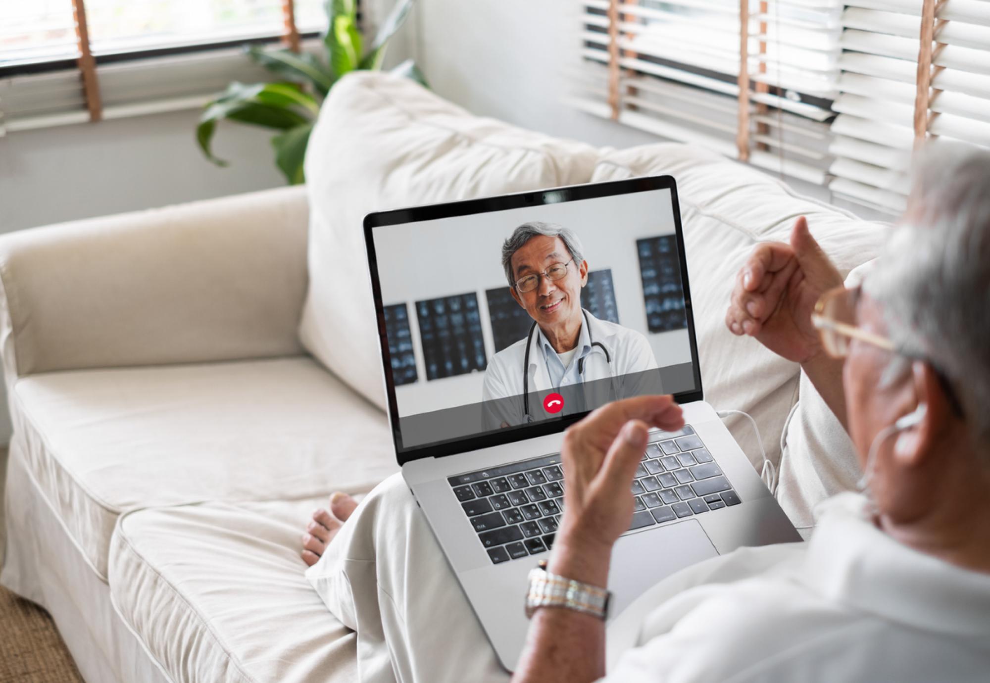 Patient on a call with a doctor depicting NHS virtual wards