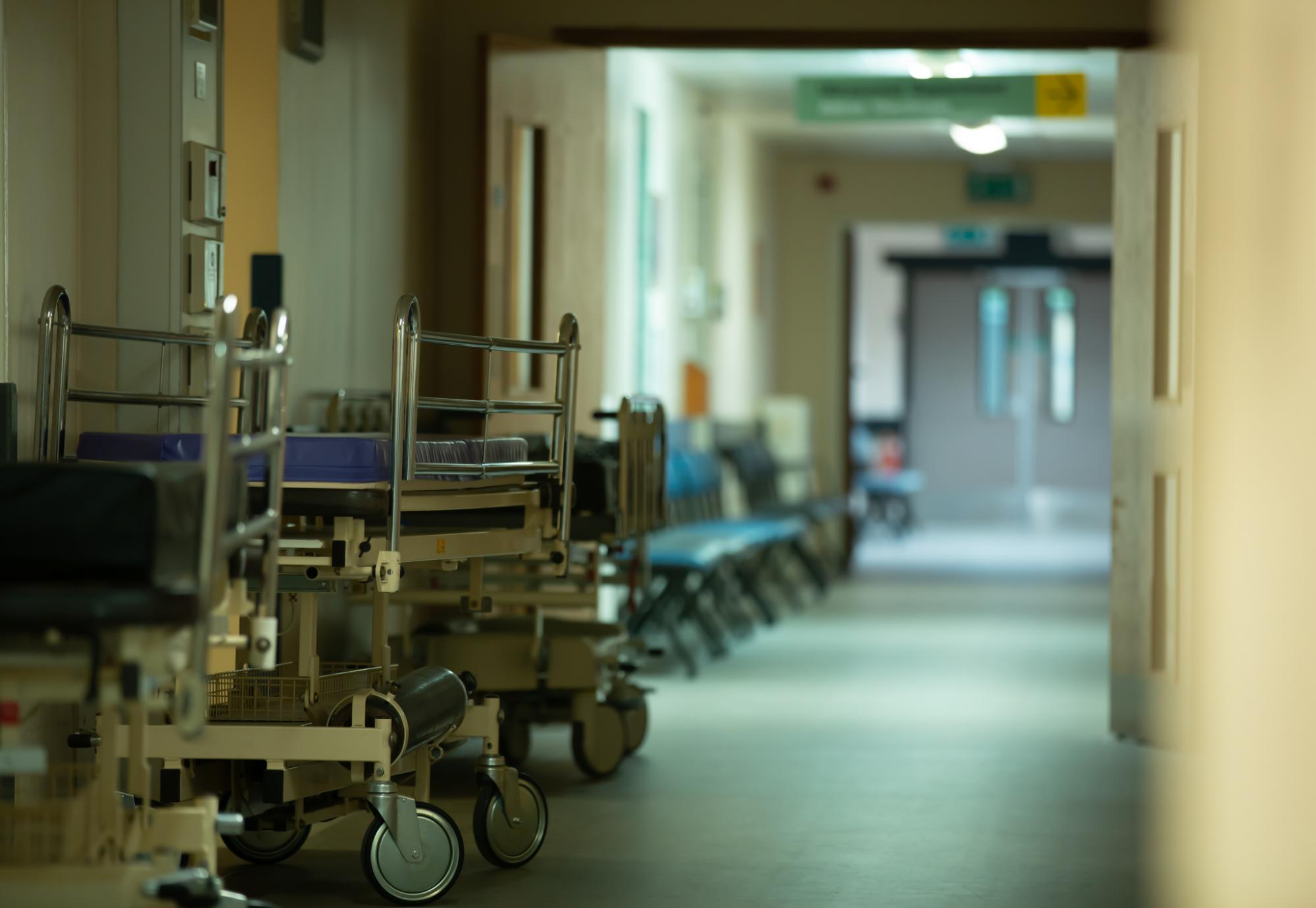 along an empty hallway of a hospital