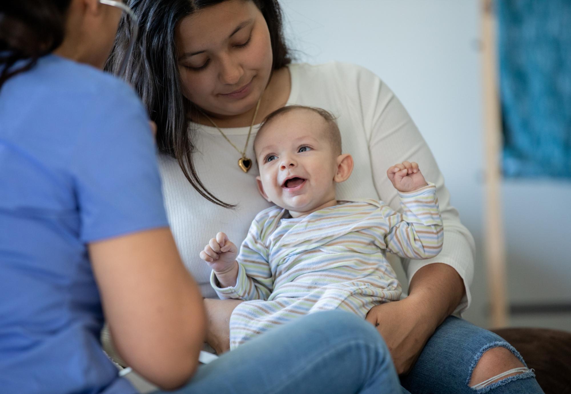 Baby with Parent and Nurse