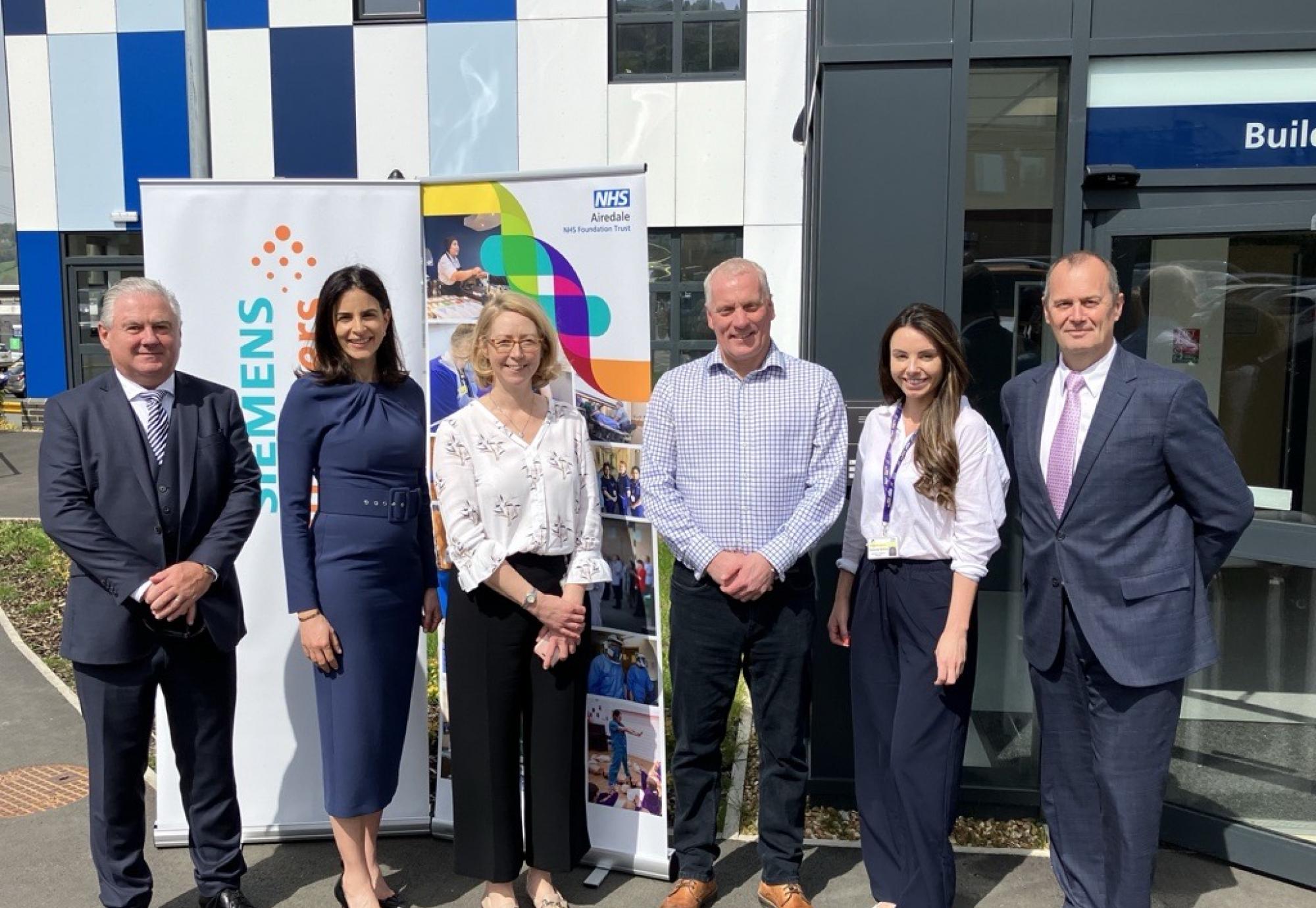 [Left to right] Neil Mearns- Regional Operations Manager, Ghada Trotabas- Managing Director at Siemens Healthineers Great Britain and Ireland, Rebecca Friar- Deputy COO and Divisional Operations Director for Surgery and Diagnostics at Airedale NHS Foundation Trust, Michael Atherton- Managing Director, Rosanne Buffrey- Senior Contracts Manager at AGH Solutions Ltd and Andy Wilks- Head of Enterprise Services at Siemens Healthineers Great Britain & Ireland celebrate a renewed 12-year Value Partnership. 