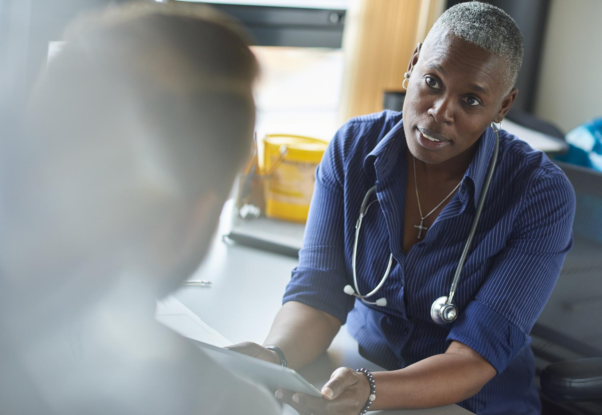 Image of a GP looking concerned