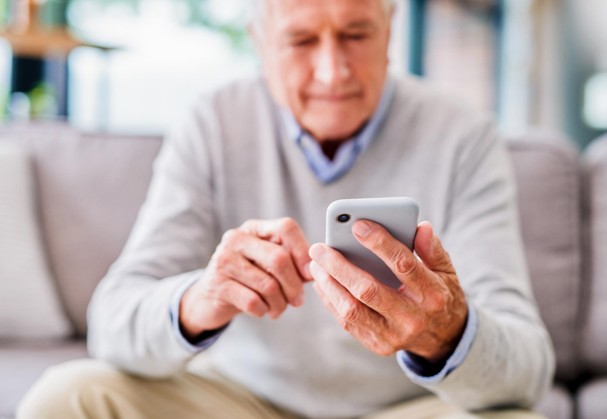 Old man using phone