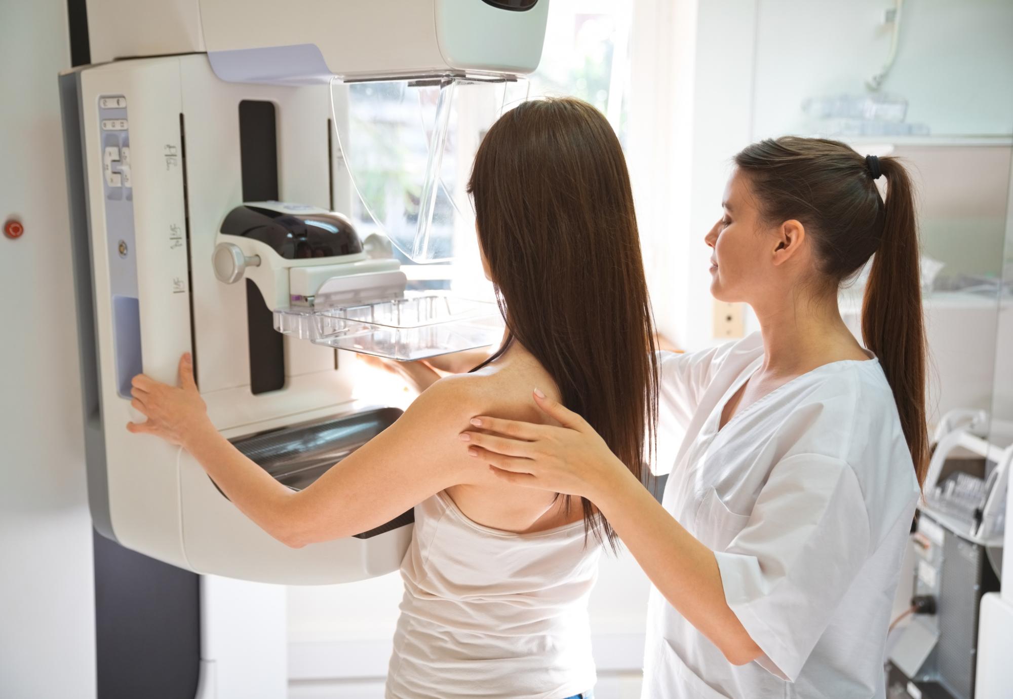 Female doctor and mid adult woman during Mammography test
