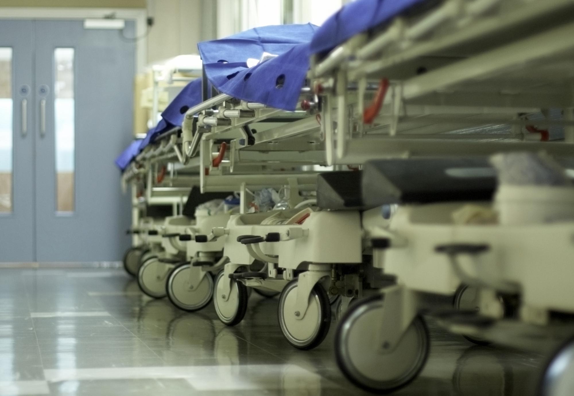 Hospital corridor with bed trolleys