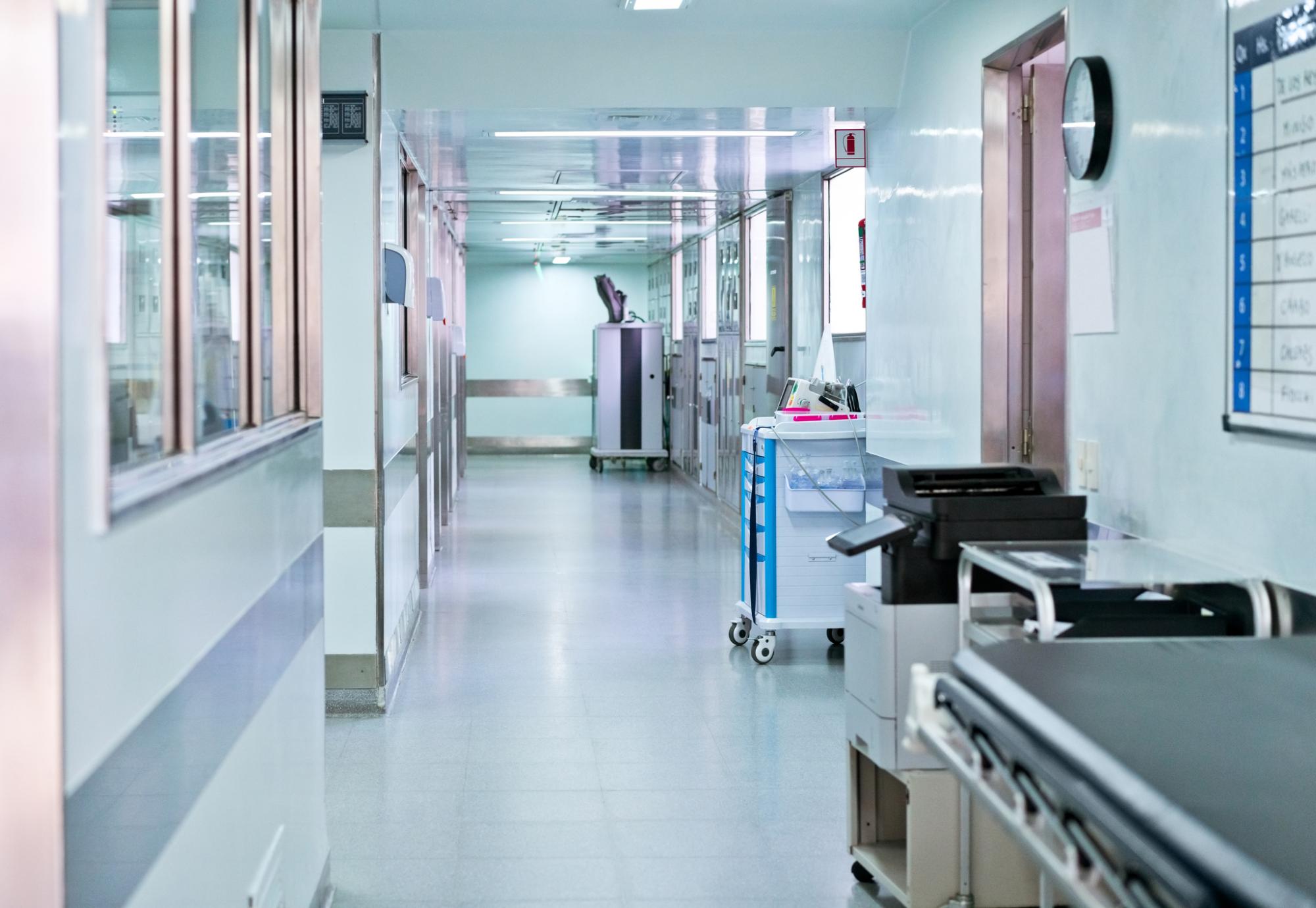 Illuminated corridor at modern hospital