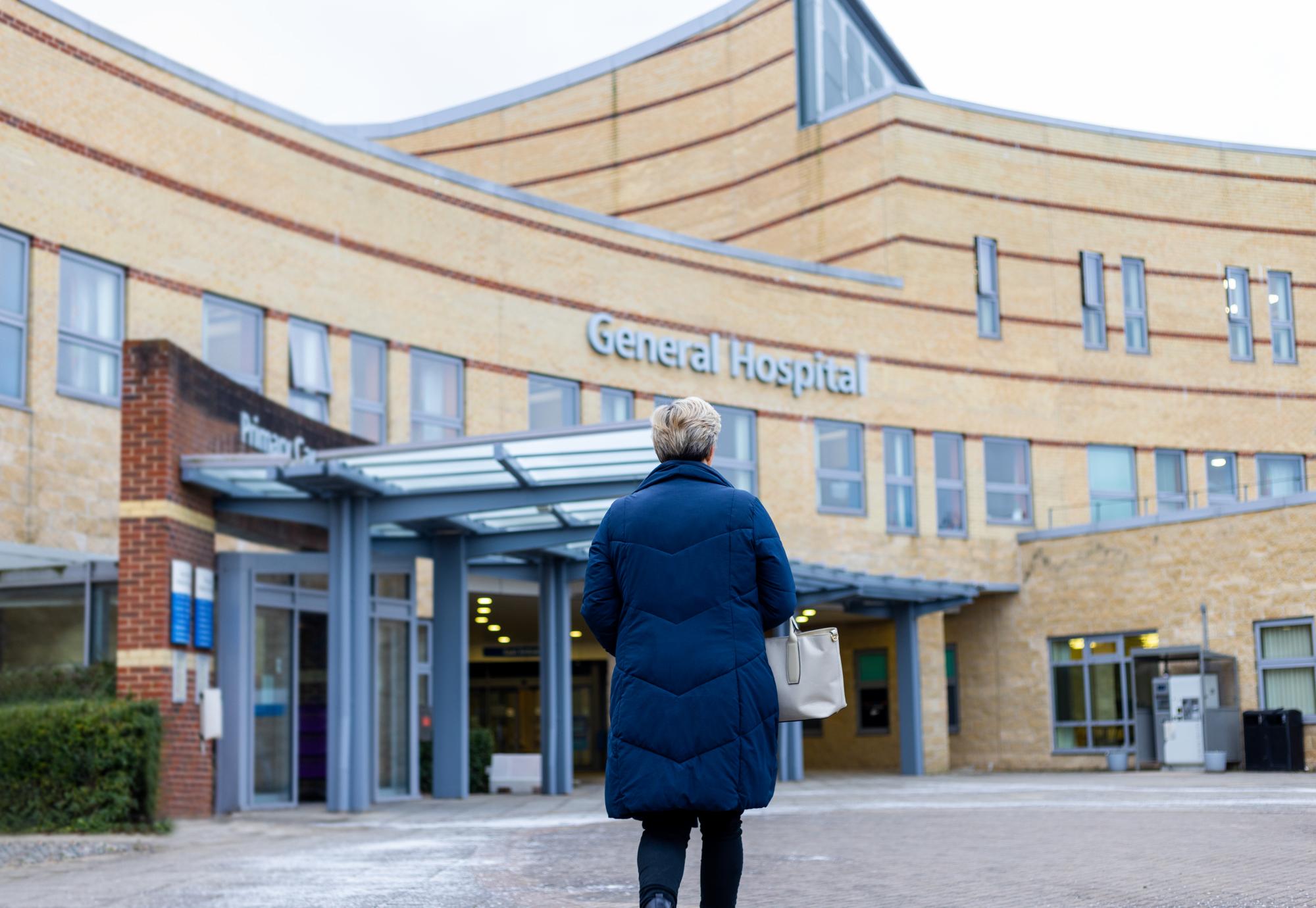 Woman stood outside a hospital