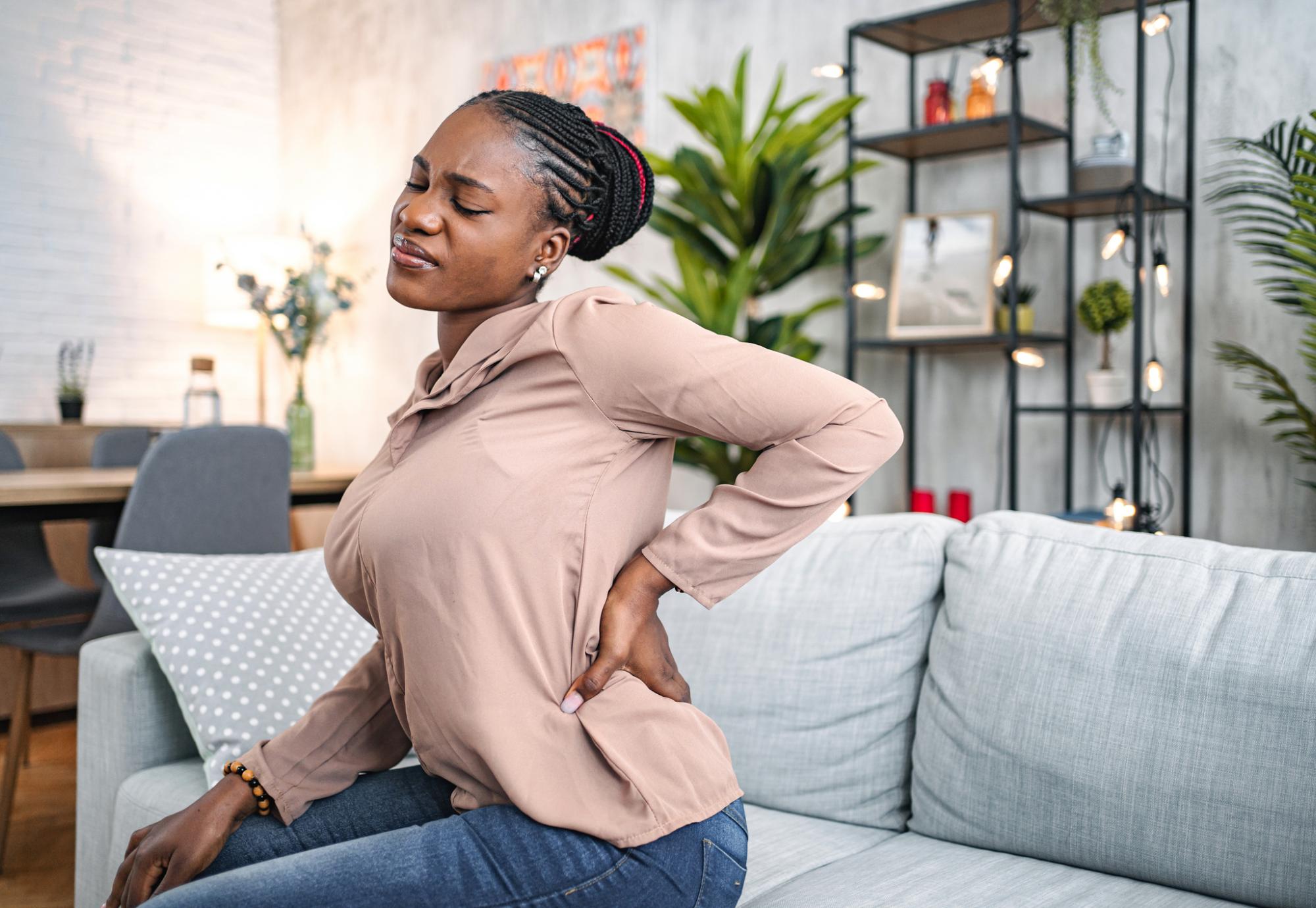 woman suffering with back pain