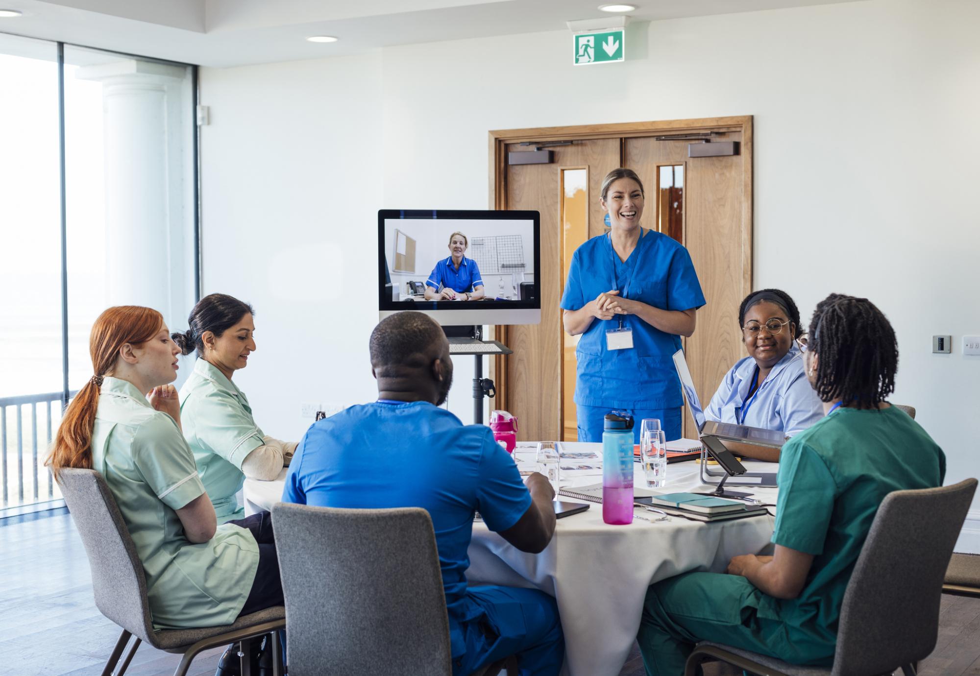 A group of healthcare professionals sitting around a table