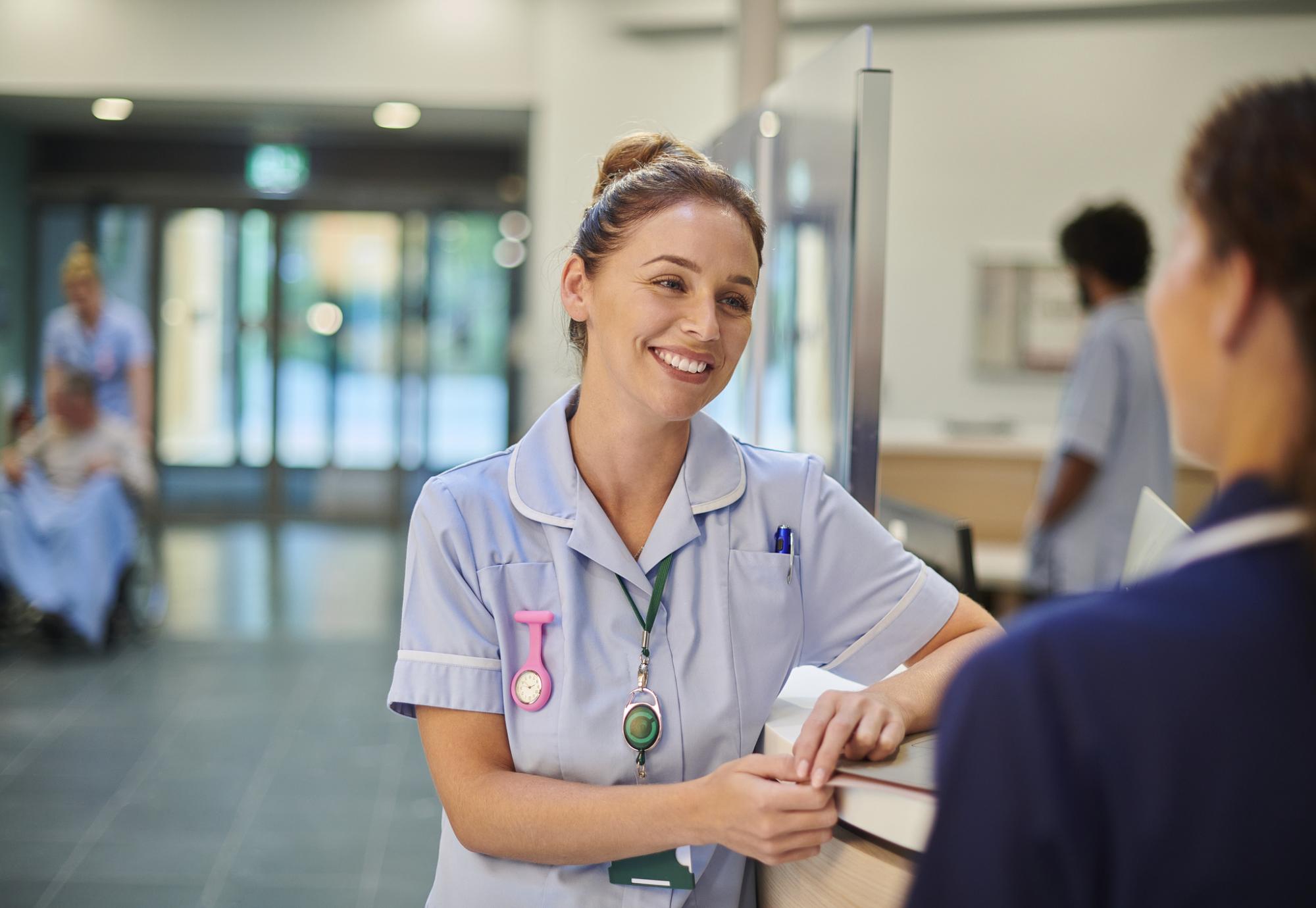 Nurse chatting to staff nurse