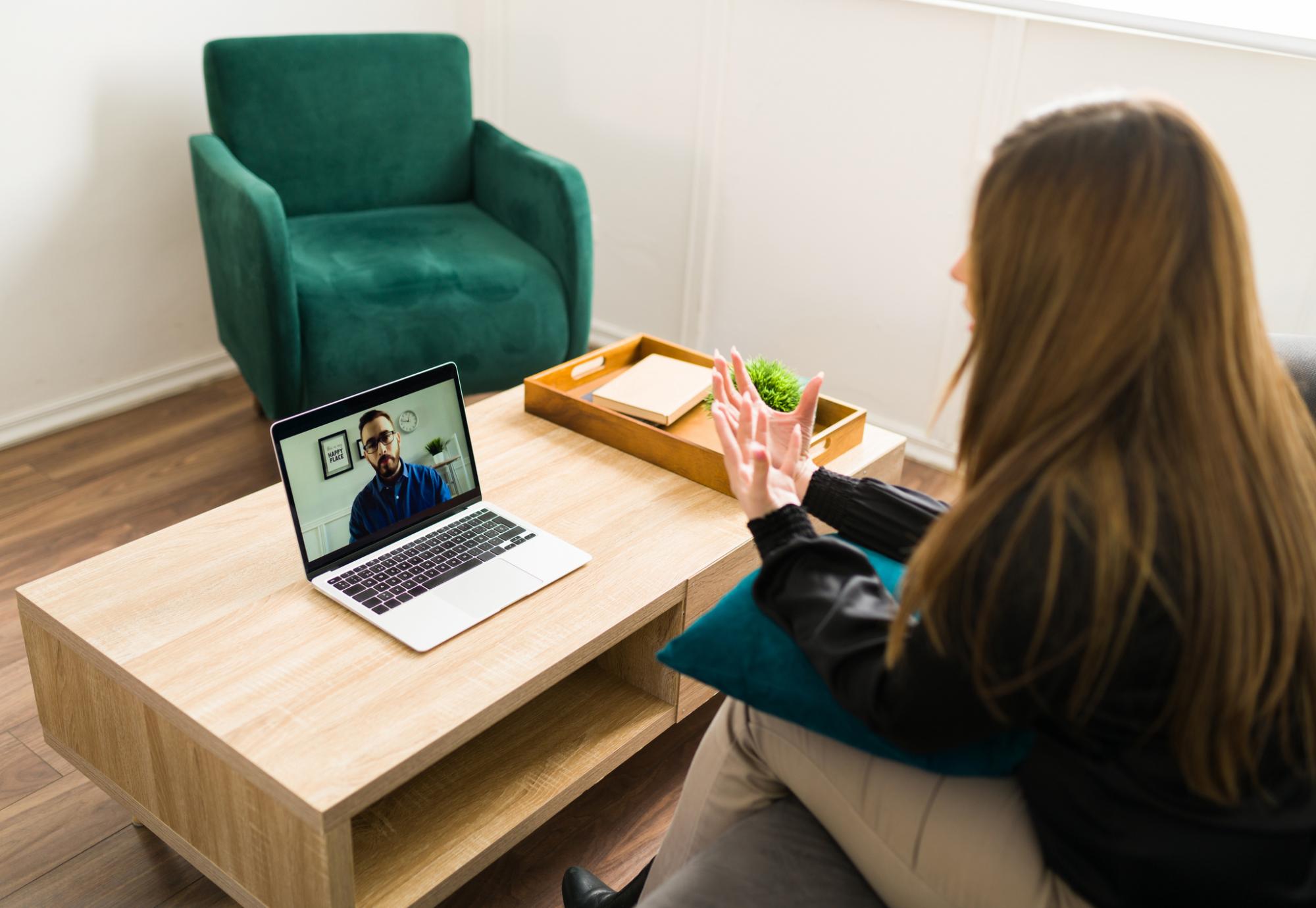 Woman talking to a virtual therapist