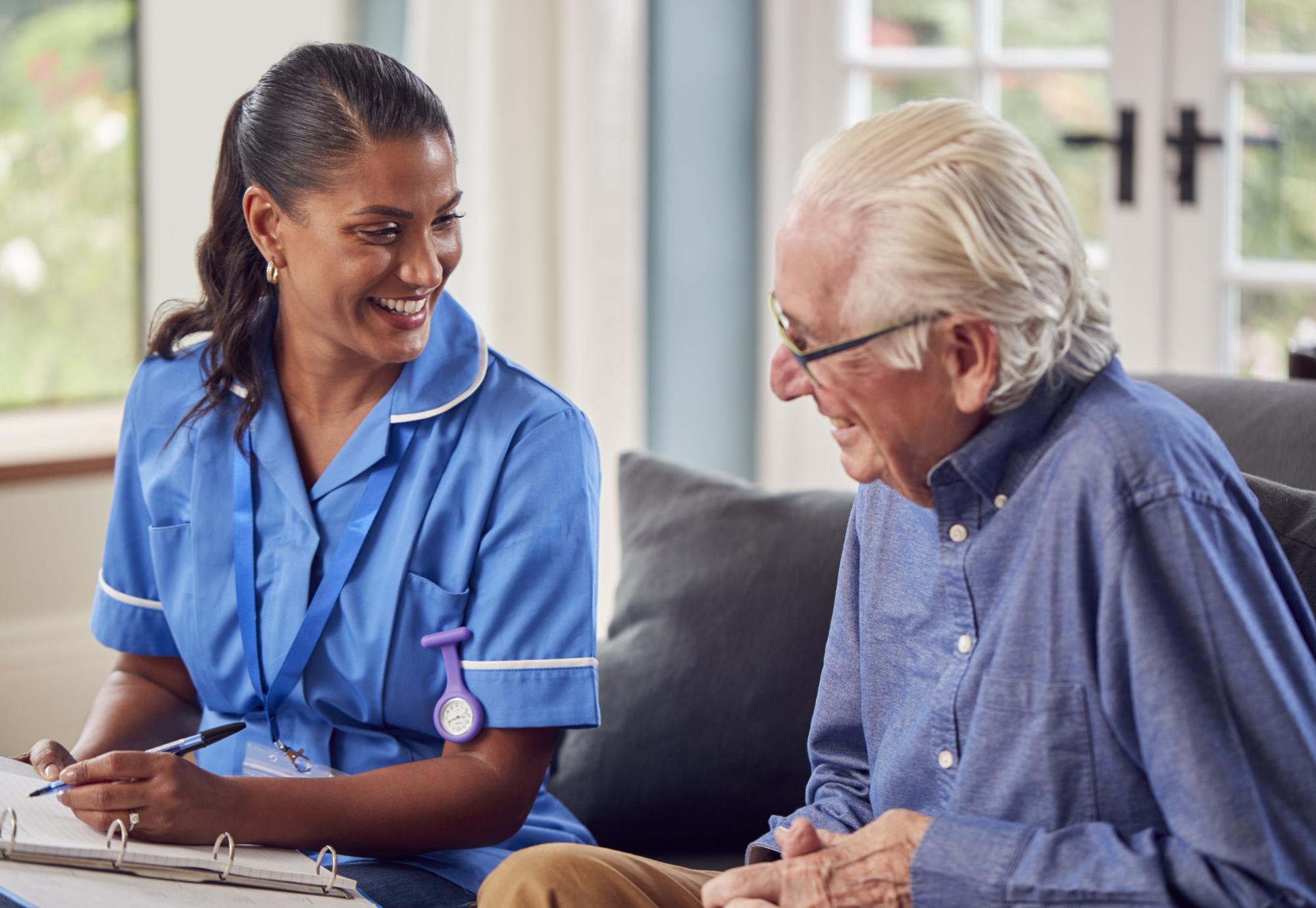 Senior man talking to a nurse