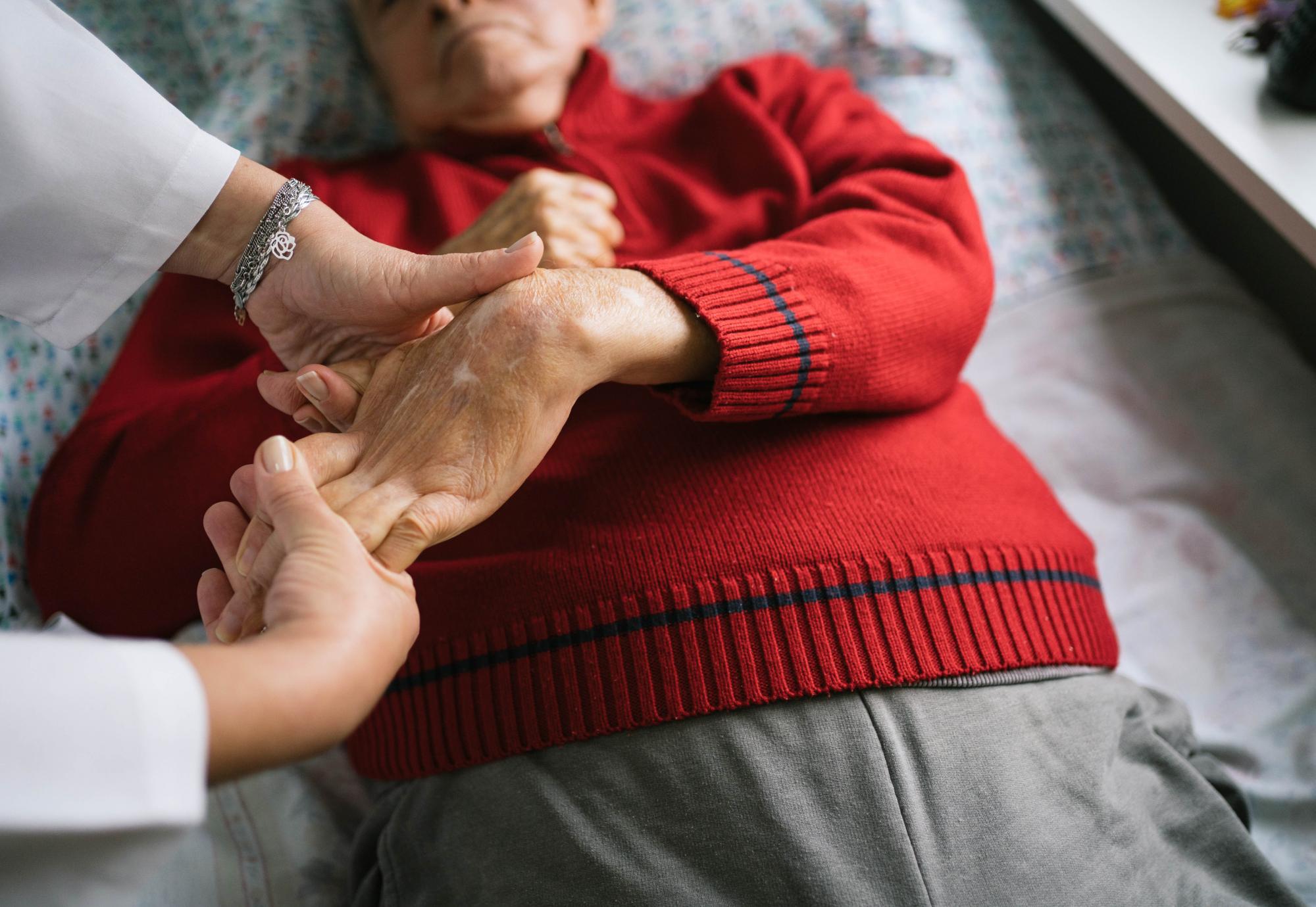 Senior man with stroke doing physical therapy