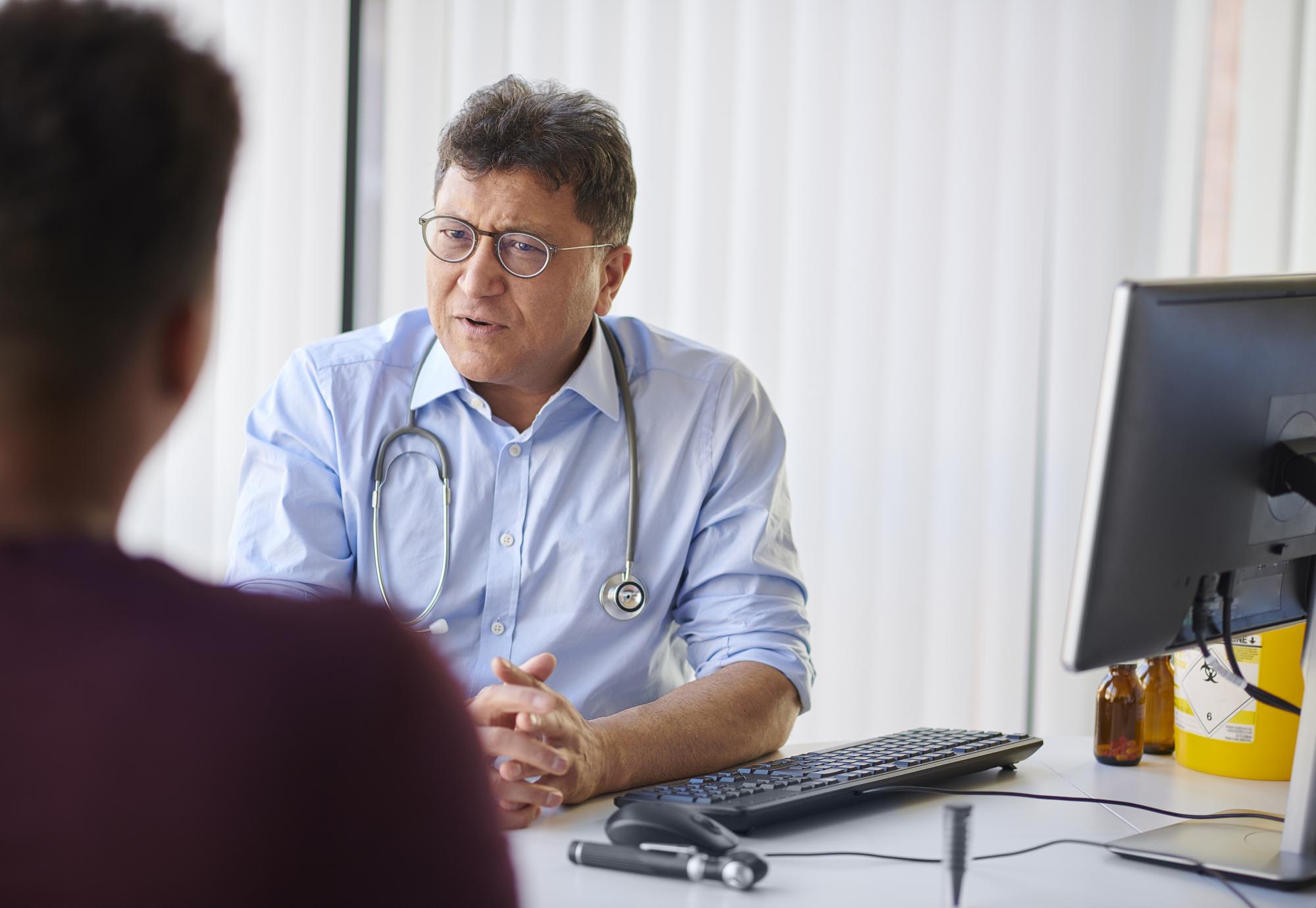 Man speaking to a GP