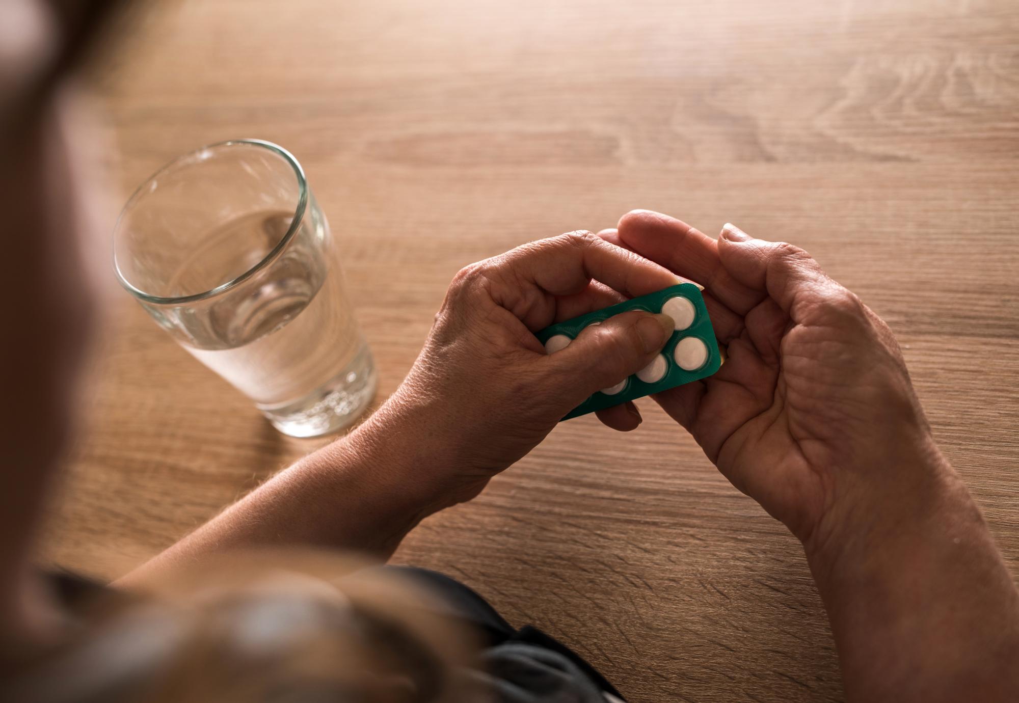 woman taking antibiotics