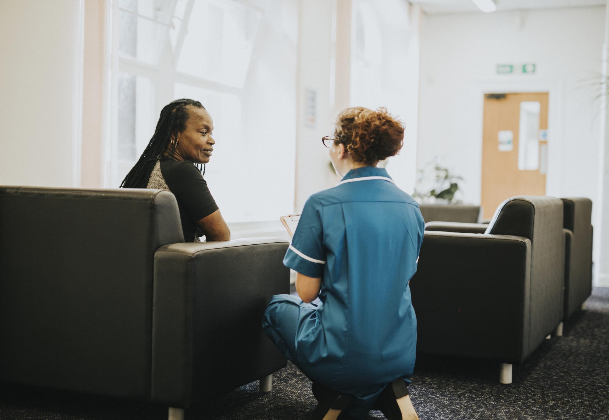 Nurse speaking to a black patient