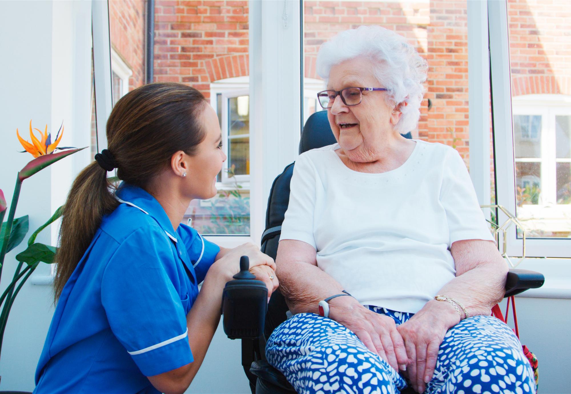 Senior woman talking to a nurse
