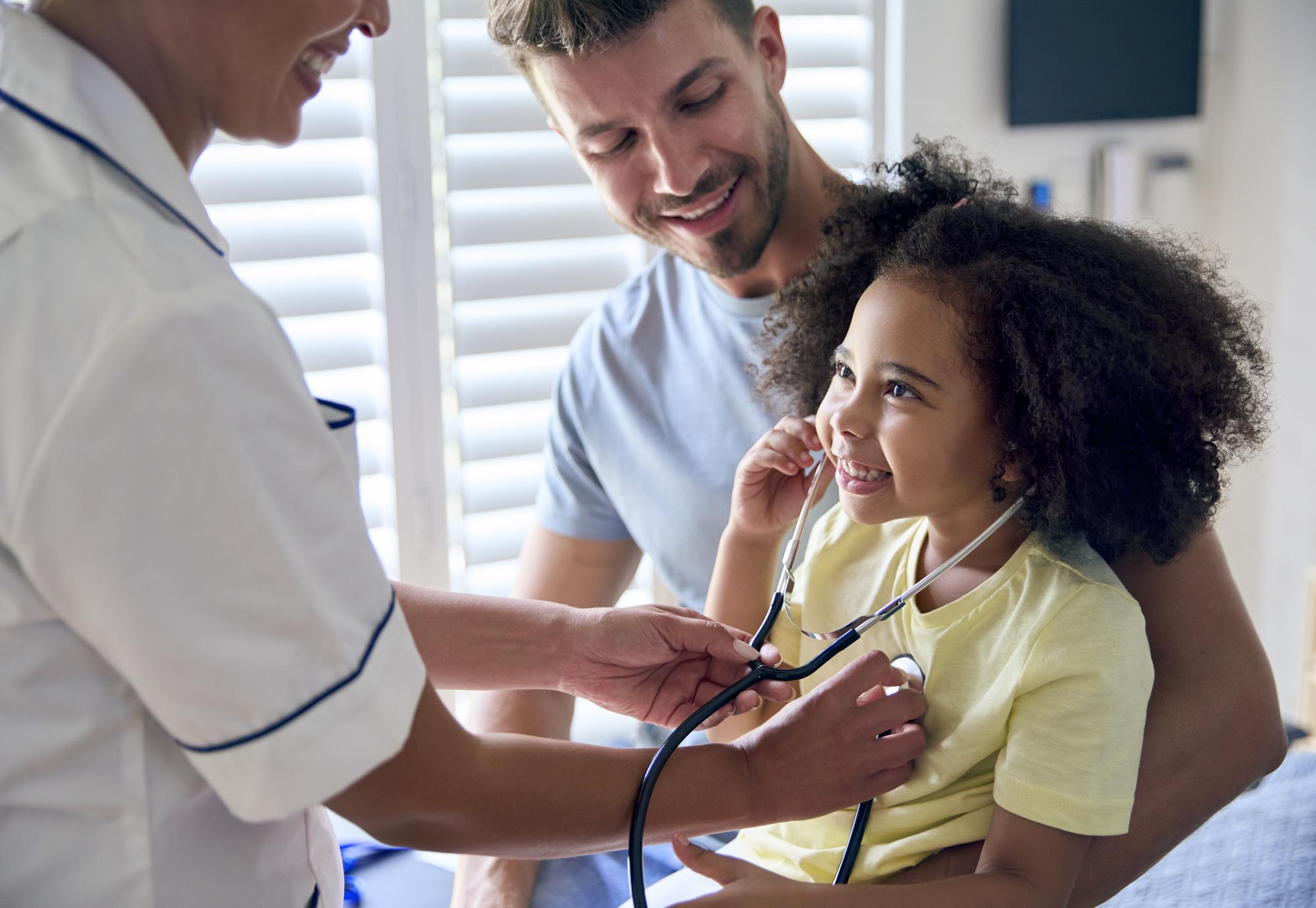Young girl being treated by a nurse
