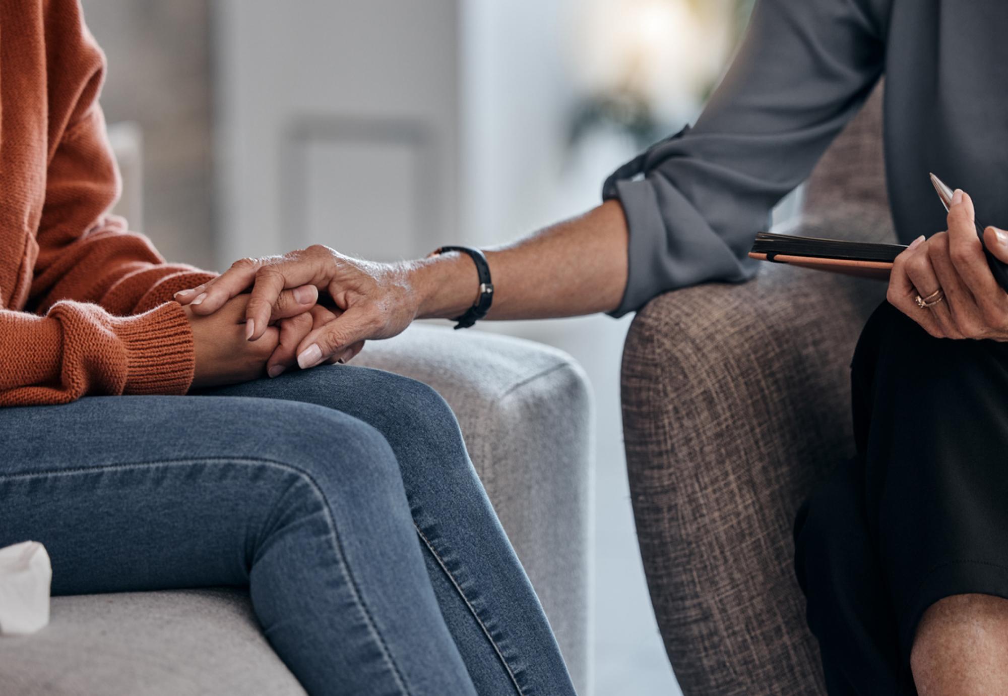 Therapist consoling a patient