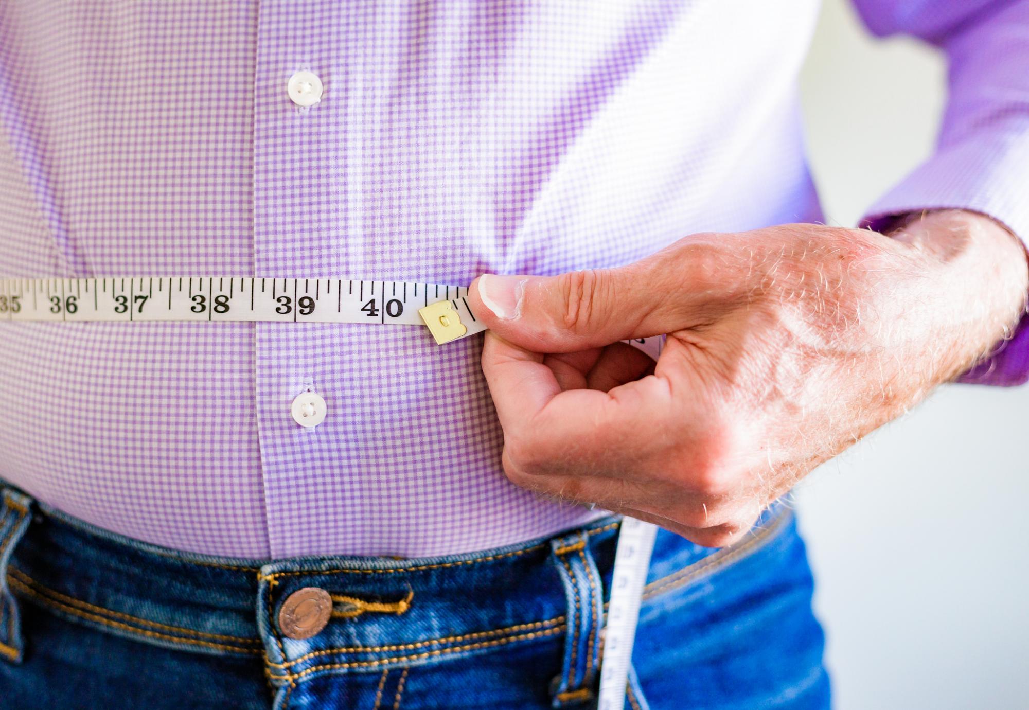 Man measuring his waist